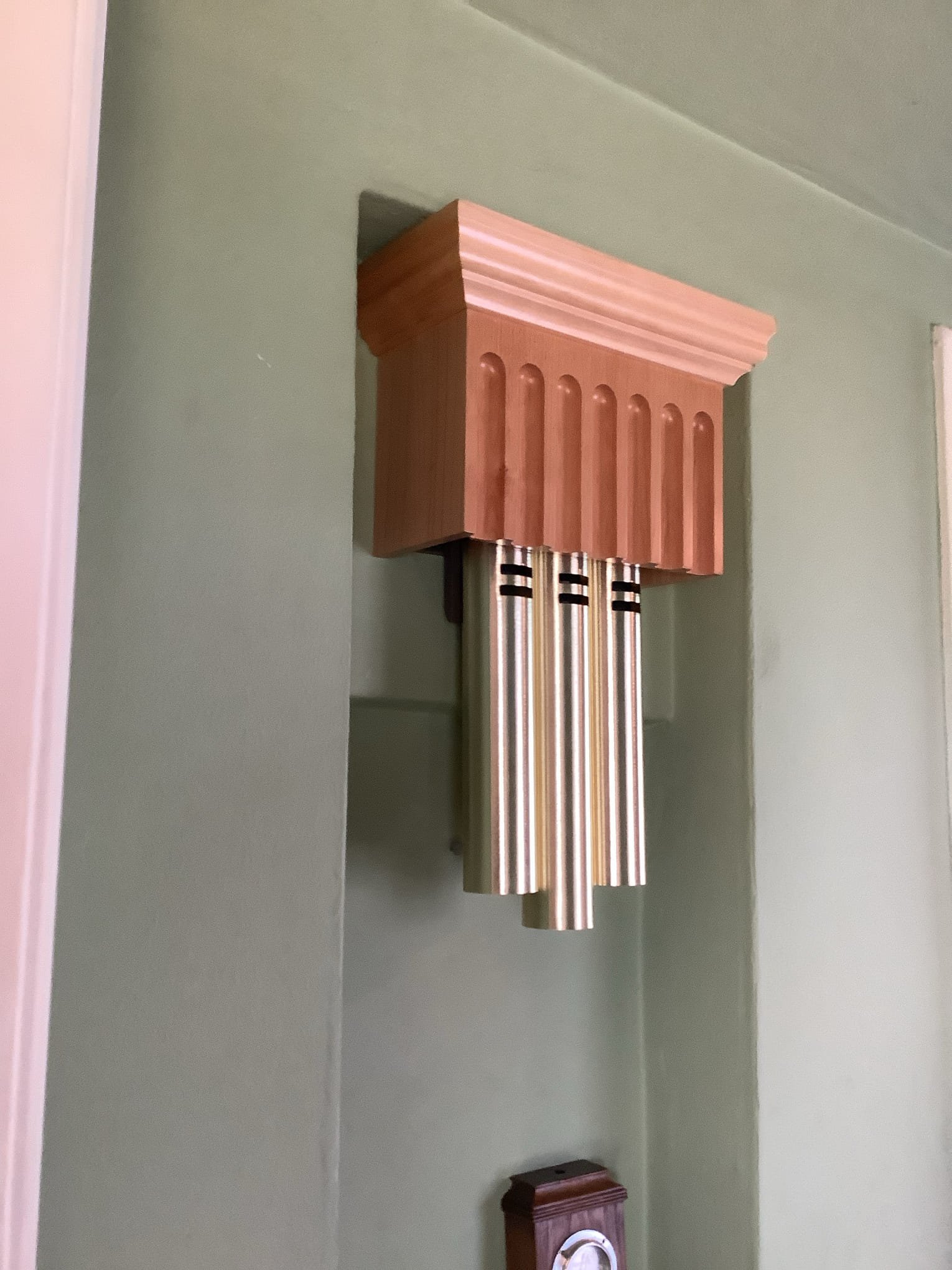 Powell Electric hides necessary conduit behind a crafted wooden cover to deliver tidy, customer-focused electrical work that complements your home.