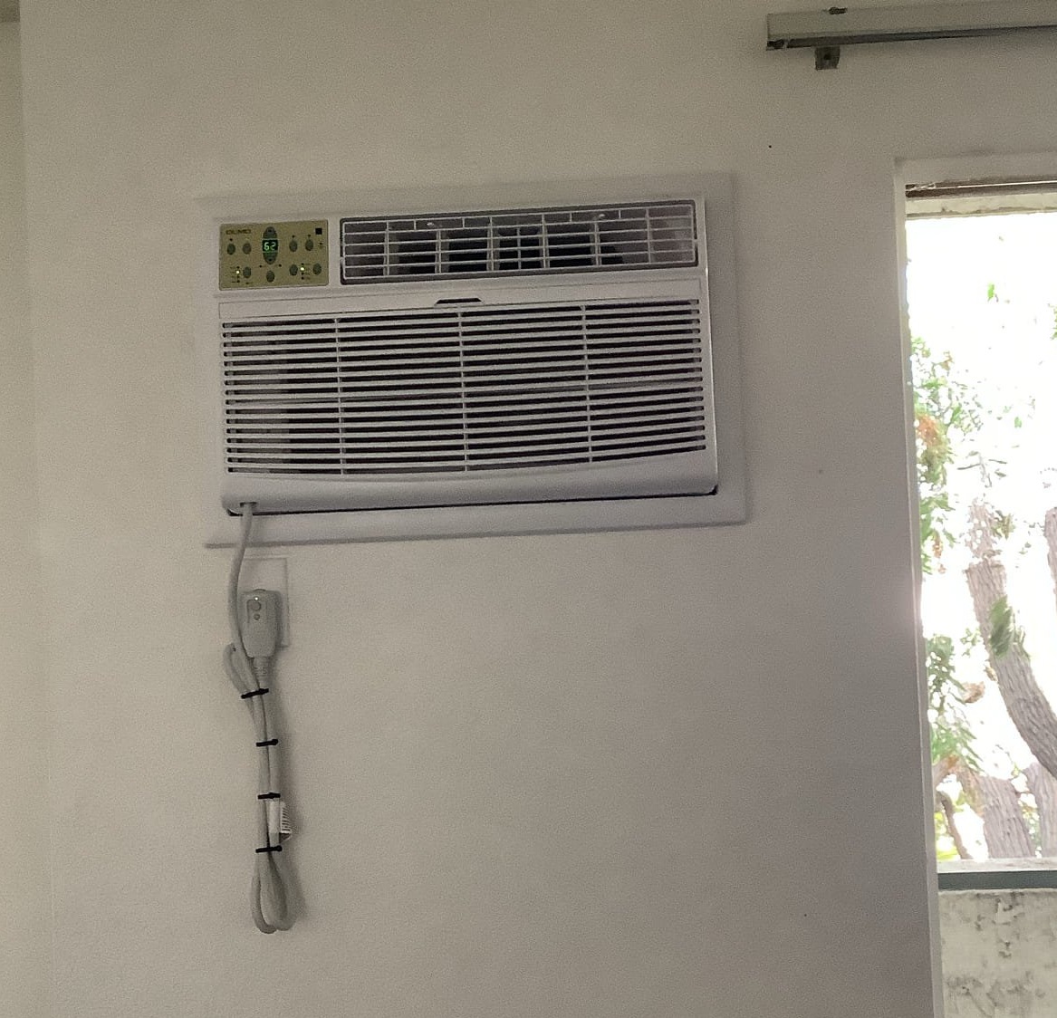Powell Electric shows careful, neat installation of a through-the-wall air conditioner to ensure reliable cooling and clean results.