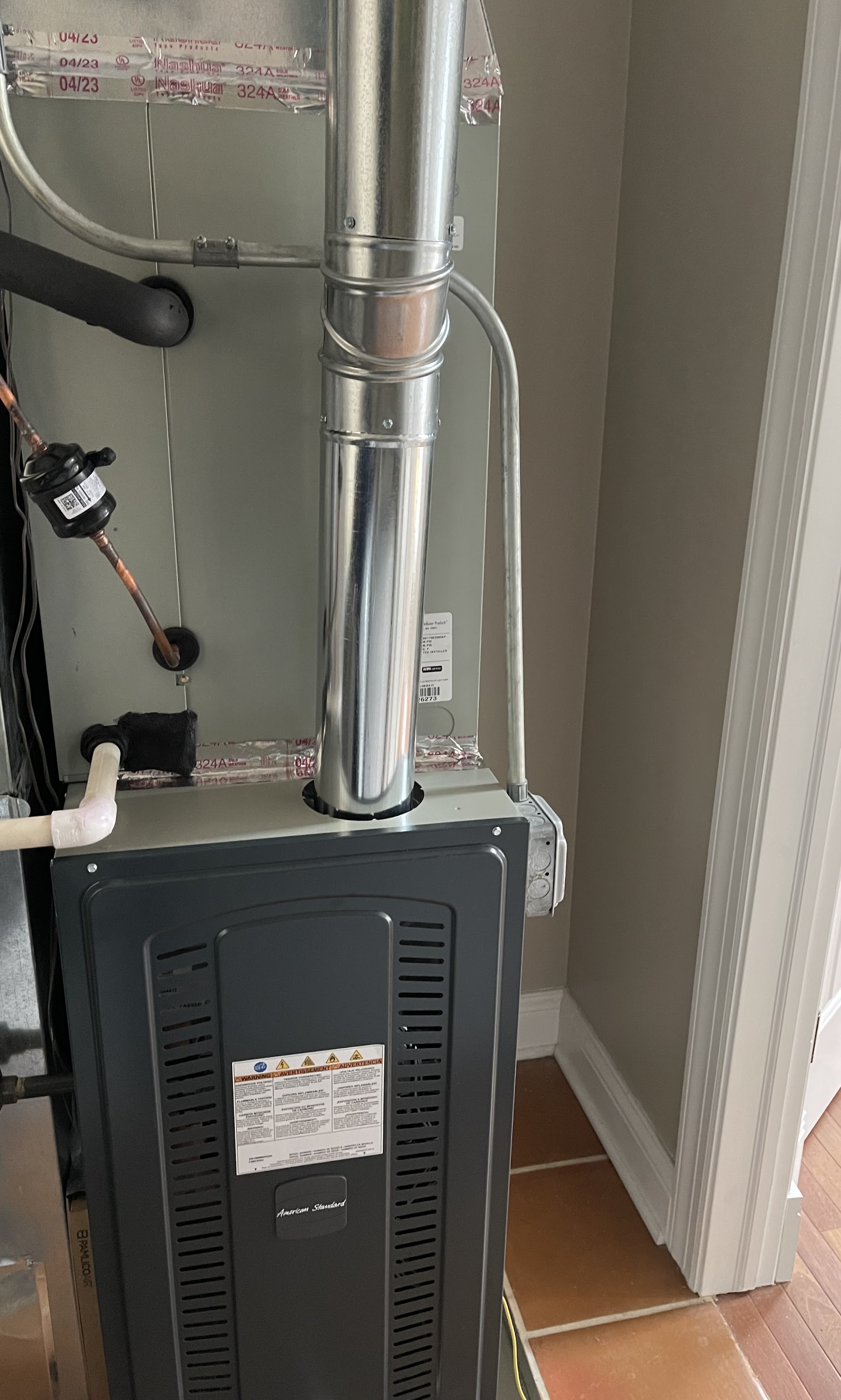 Clean, professionally installed venting and components show the care and reliability homeowners expect from Oasis Heating and Cooling.