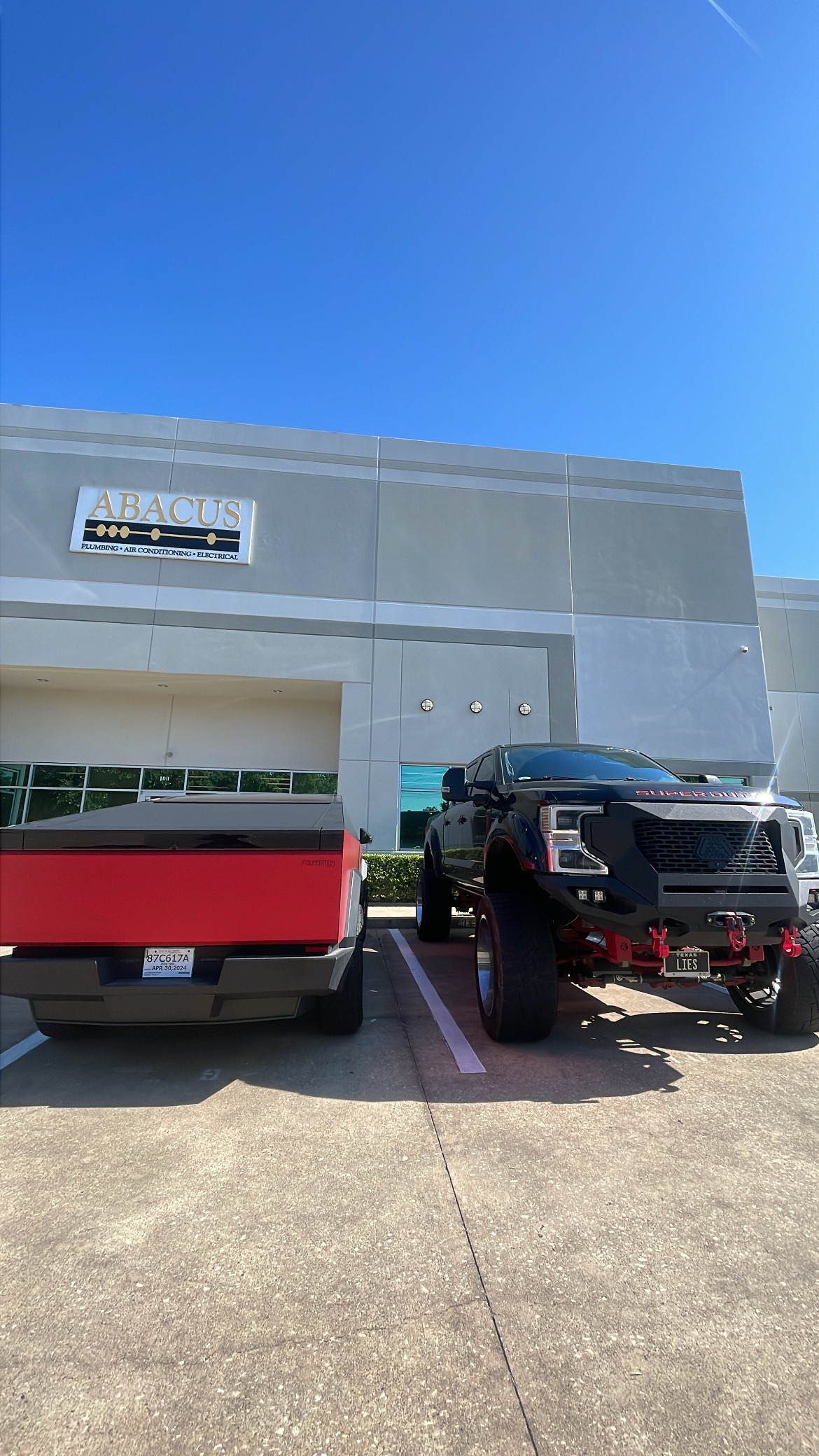 A bright, professional storefront and clear signage showcase Abacus Plumbing, Air Conditioning & Electrical as a trusted local service provider.