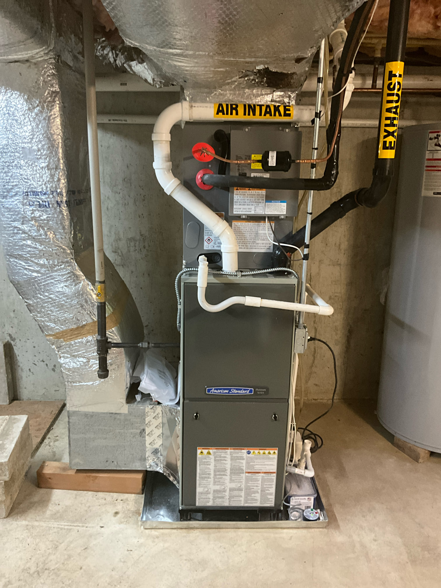 Reliable, professionally installed HVAC equipment in the basement shows the care Akian Plumbing, Heating, Cooling & Electric brings to every job.