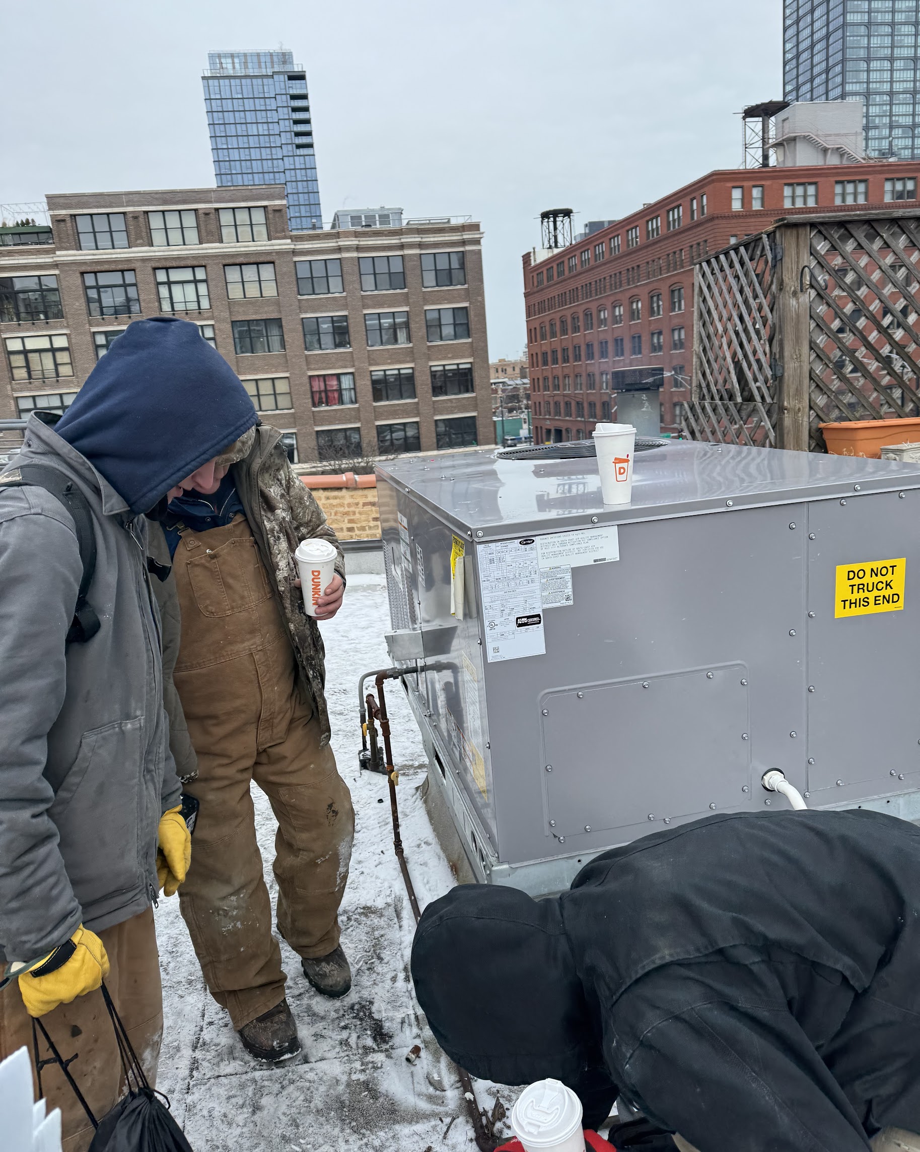 On a chilly rooftop our team shows dependable workmanship and attention to detail, trust Oasis Heating and Cooling for reliable service.