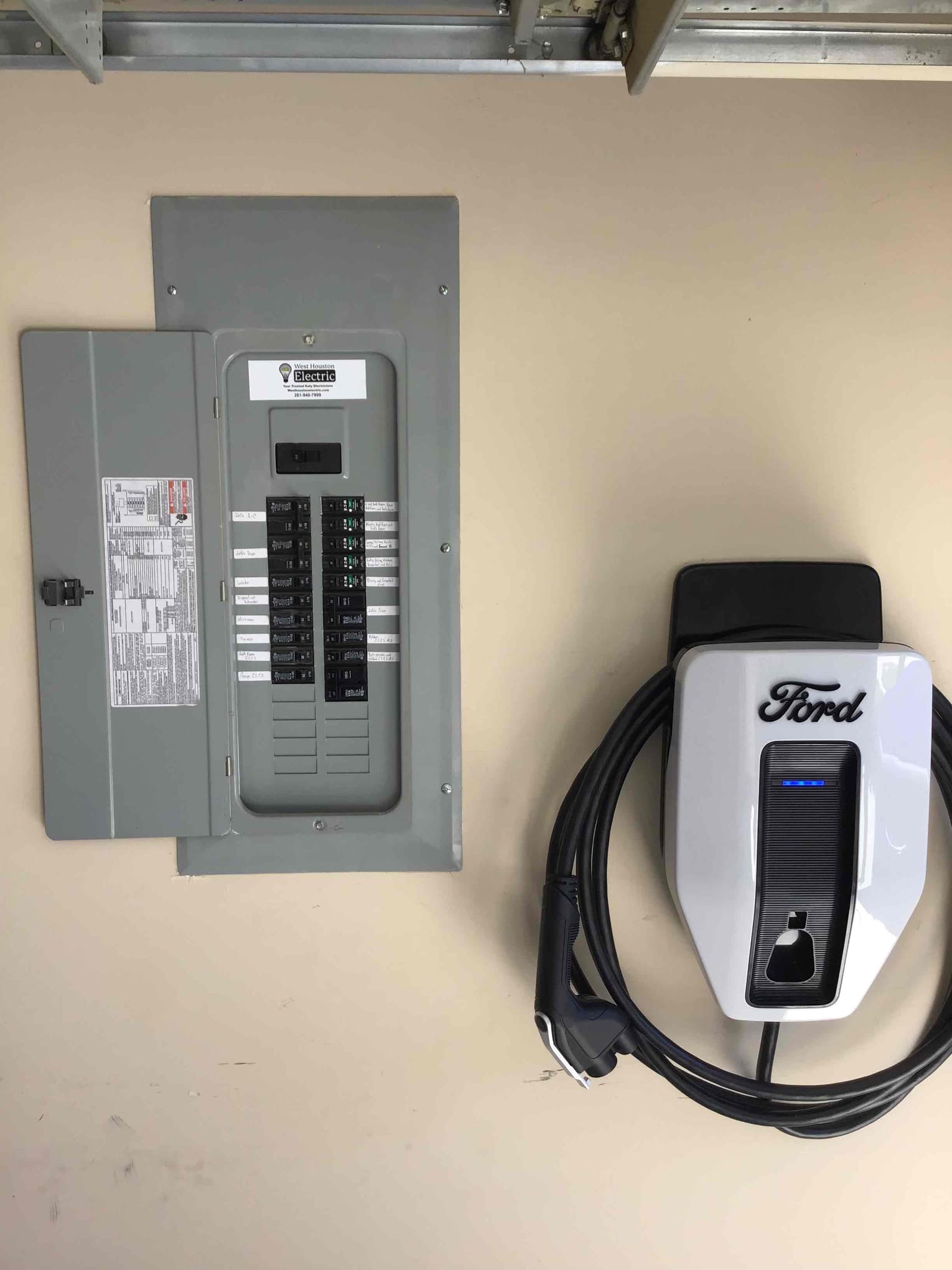 Clean, code-conscious installation of an EV charger and panel by West Houston Electric, Inc. highlights dependable, professional workmanship.