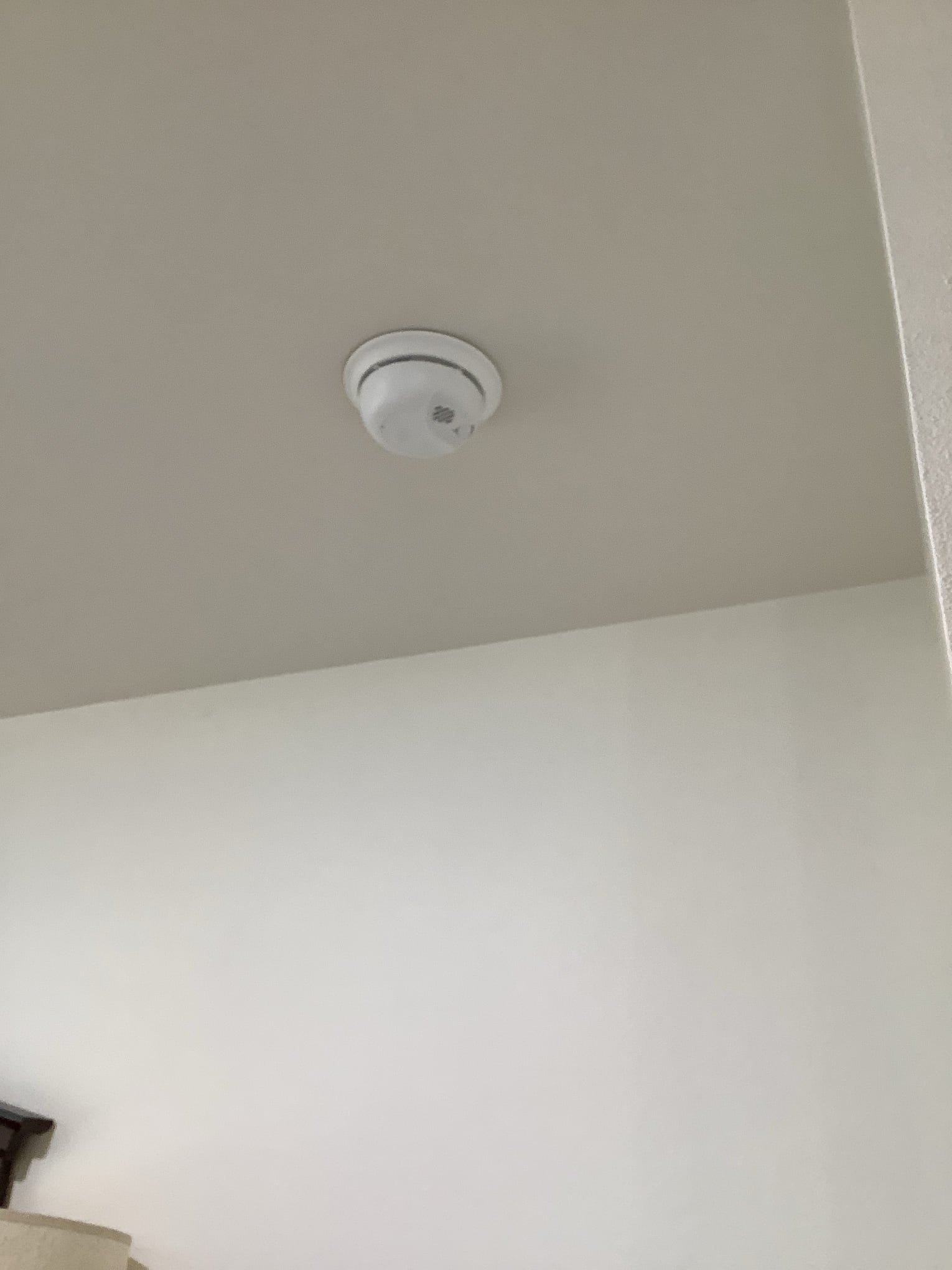 Powell Electric shows dependable safety-first installations with a neatly mounted ceiling detector for reliable home protection.