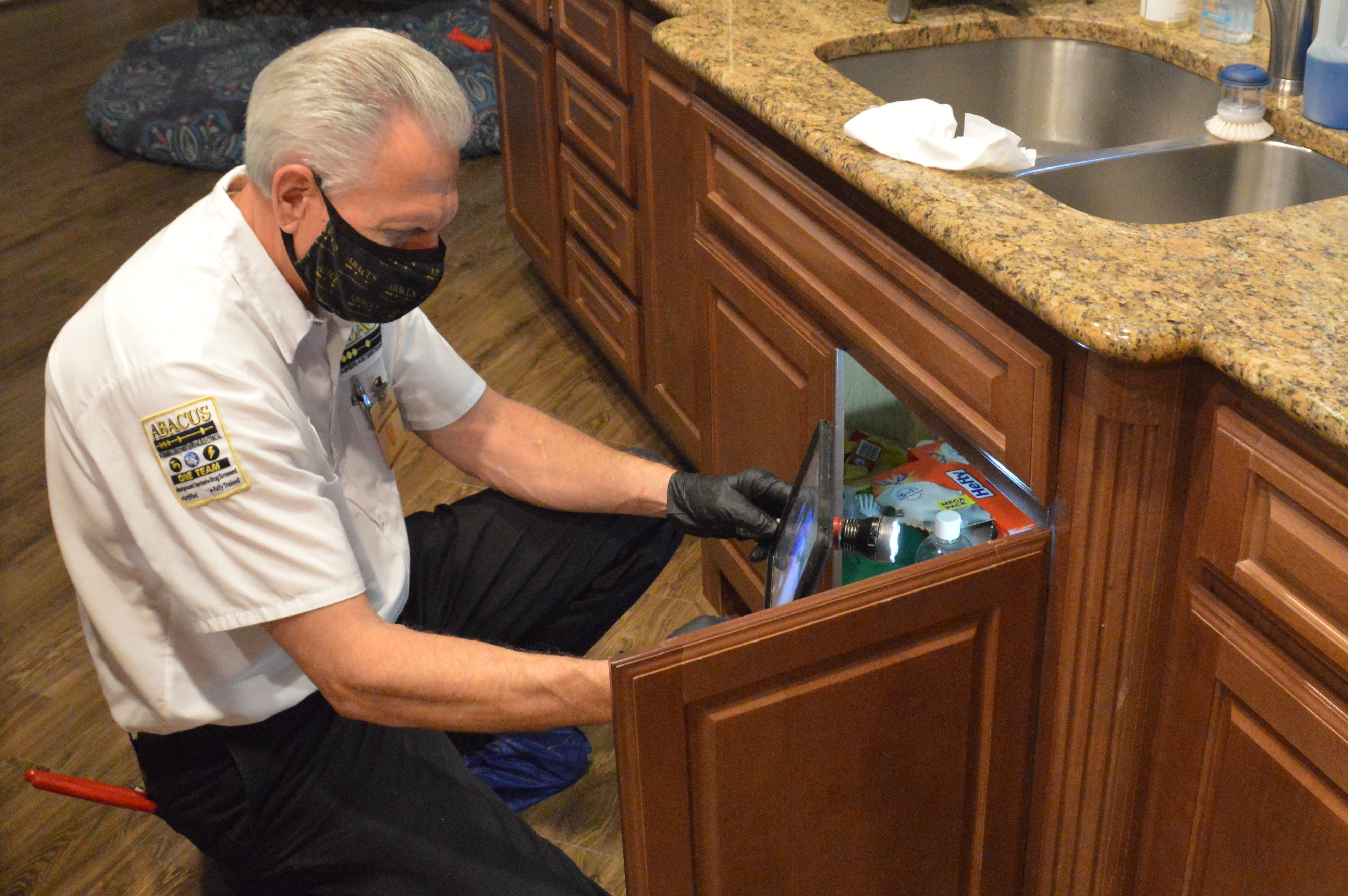 A skilled Abacus Plumbing, Air Conditioning, & Electrical technician provides careful, clean cabinet-level plumbing inspection to protect your home.