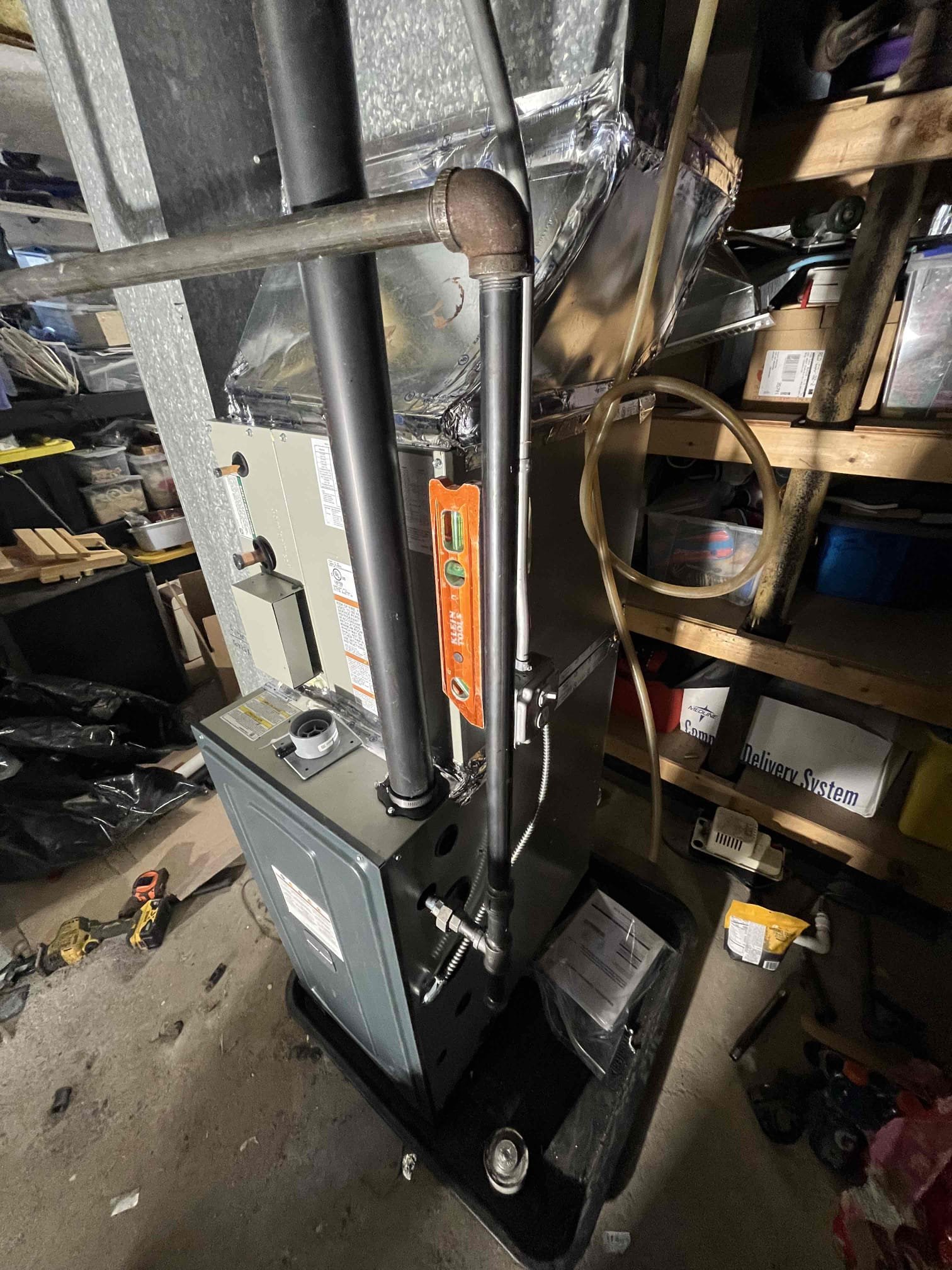 Trust Akian Plumbing, Heating, Cooling & Electric for precise furnace installations, shown here with careful vent sealing and condensate management.