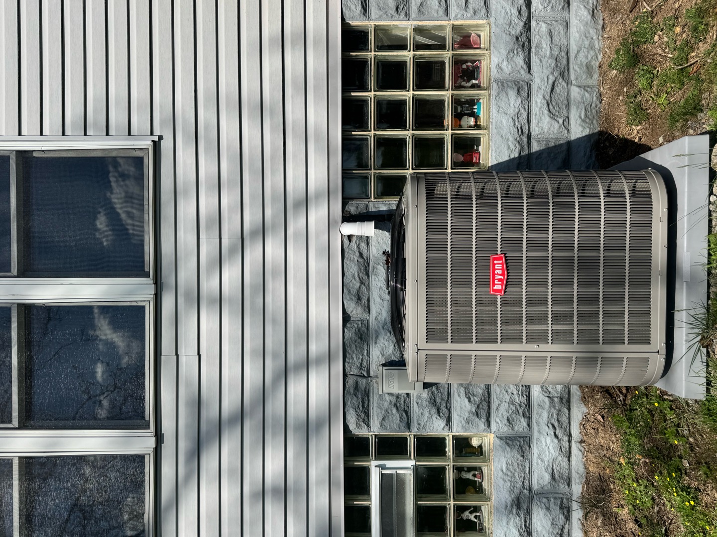 A tidy, professionally installed Bryant outdoor unit shows the care and reliability customers can expect from Boehmer Heating & Cooling.