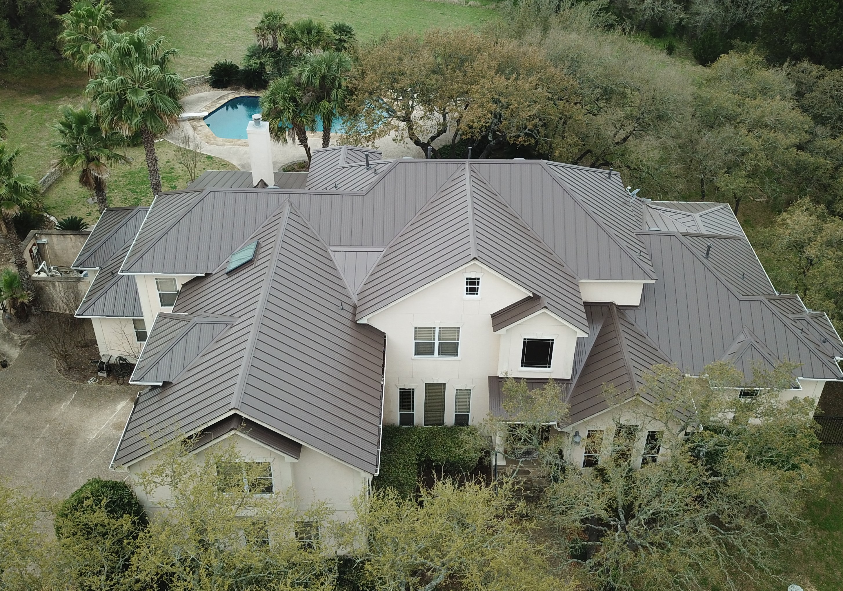 Discover the elegance and durability of our expertly installed roofing with Green Knight® Metal Roofing.