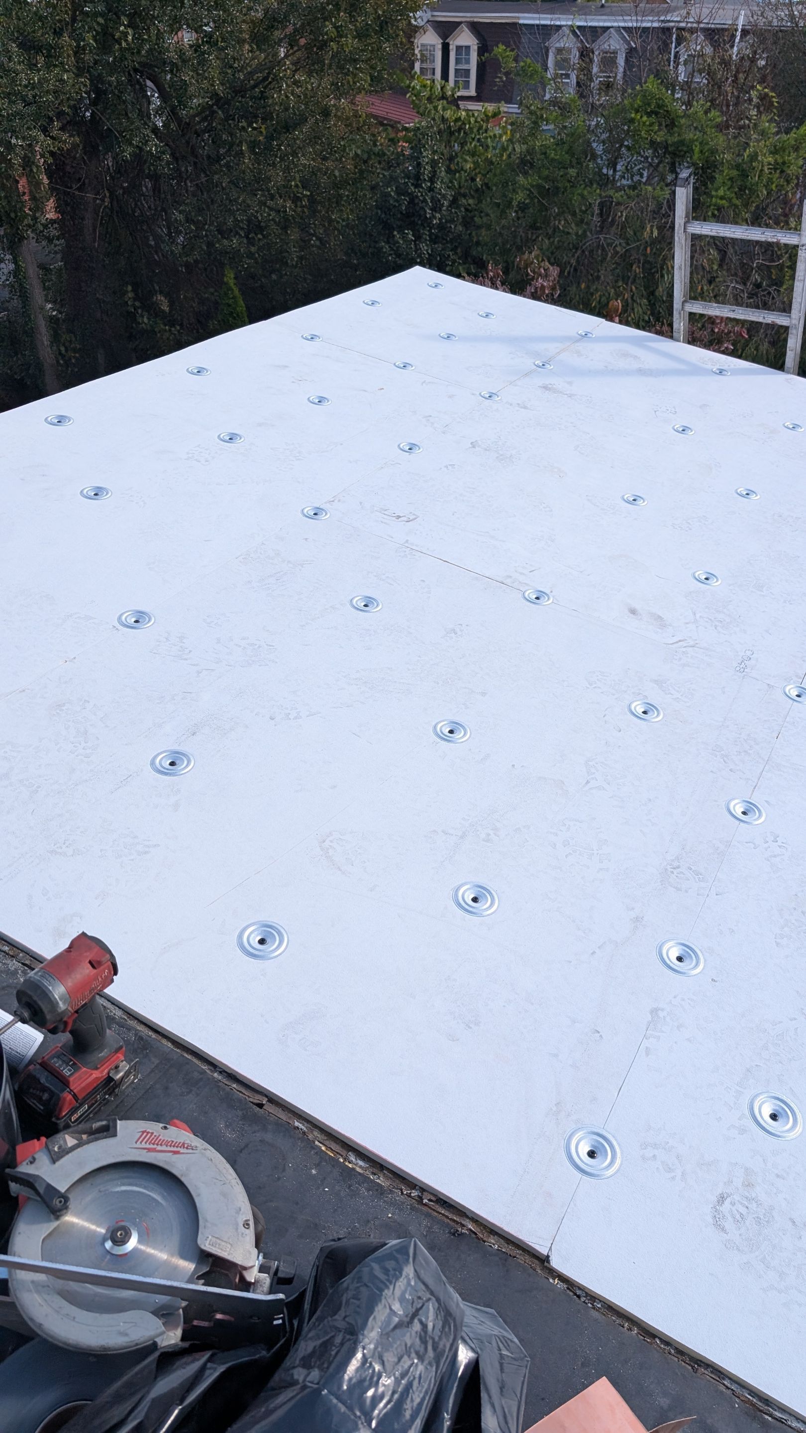 Showing precise, durable flat roof installation, Mosaic Roofing & Exteriors demonstrates workmanship and organized jobsite practices that protect your home.