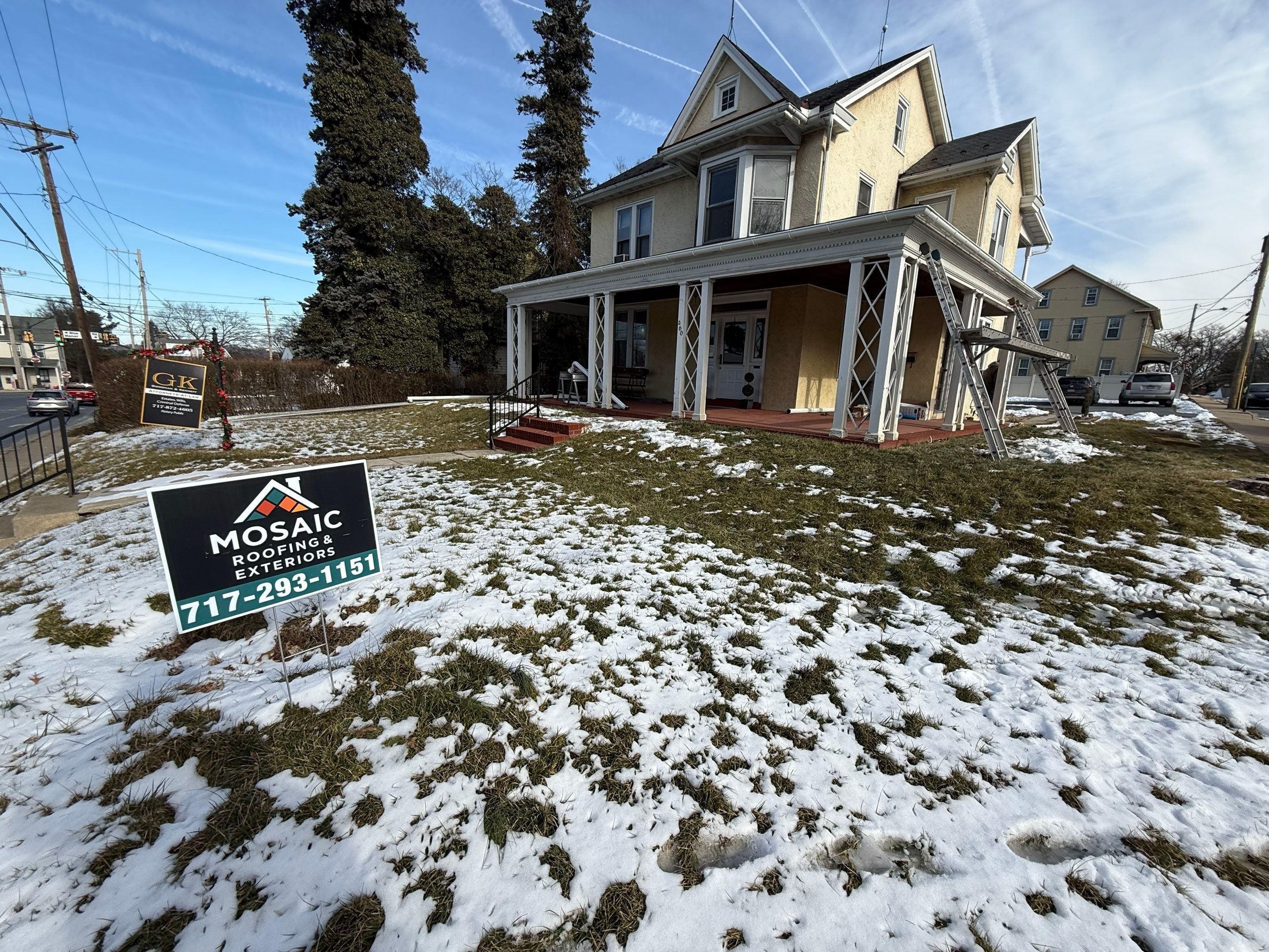 Showing dependable craftsmanship on a snowy day, Mosaic Roofing & Exteriors demonstrates reliable residential roof and exterior service.