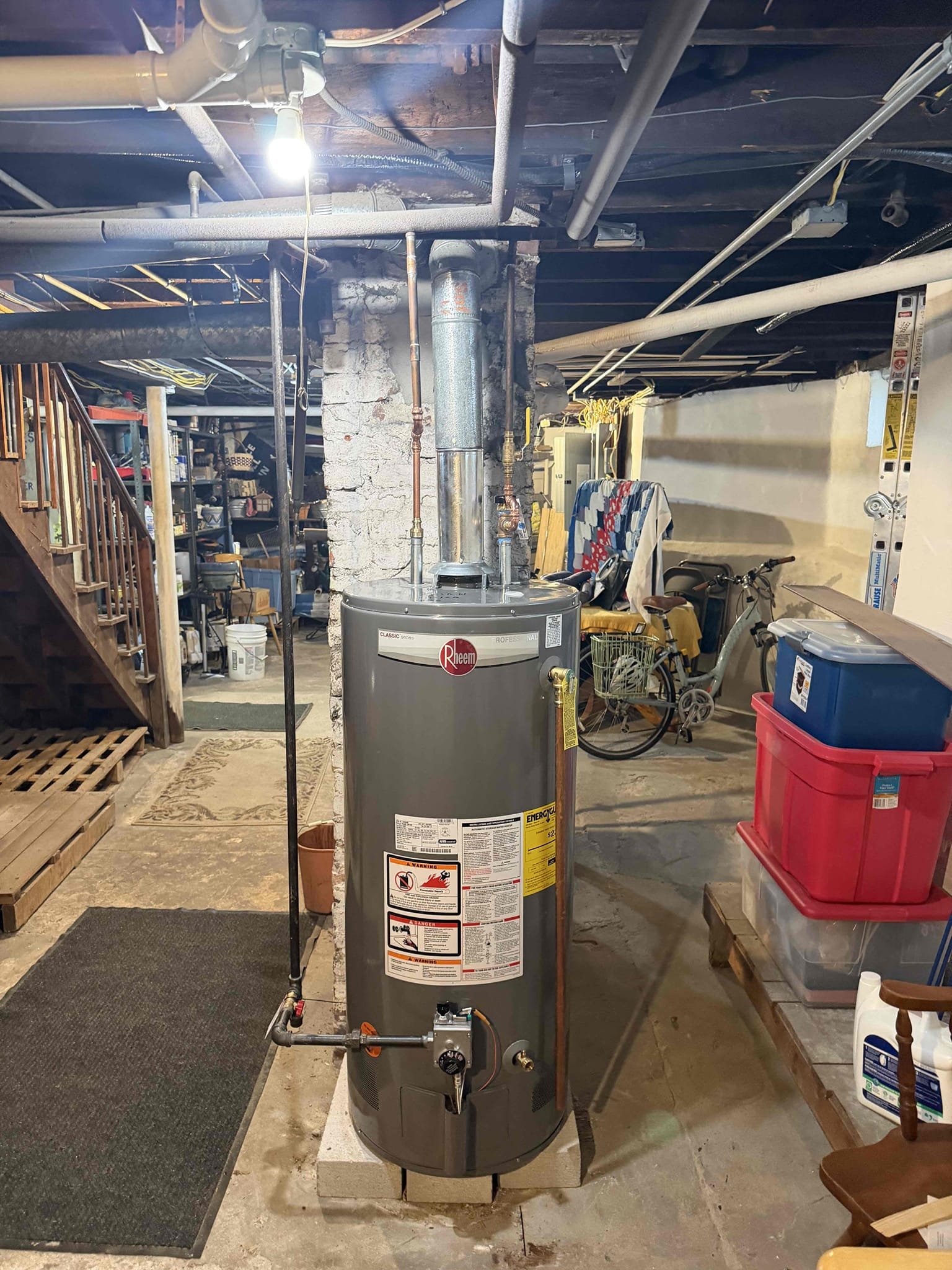 A newly installed Rheem water heater shows reliable craftsmanship and lasting value from Akian Plumbing, Heating, Cooling & Electric.