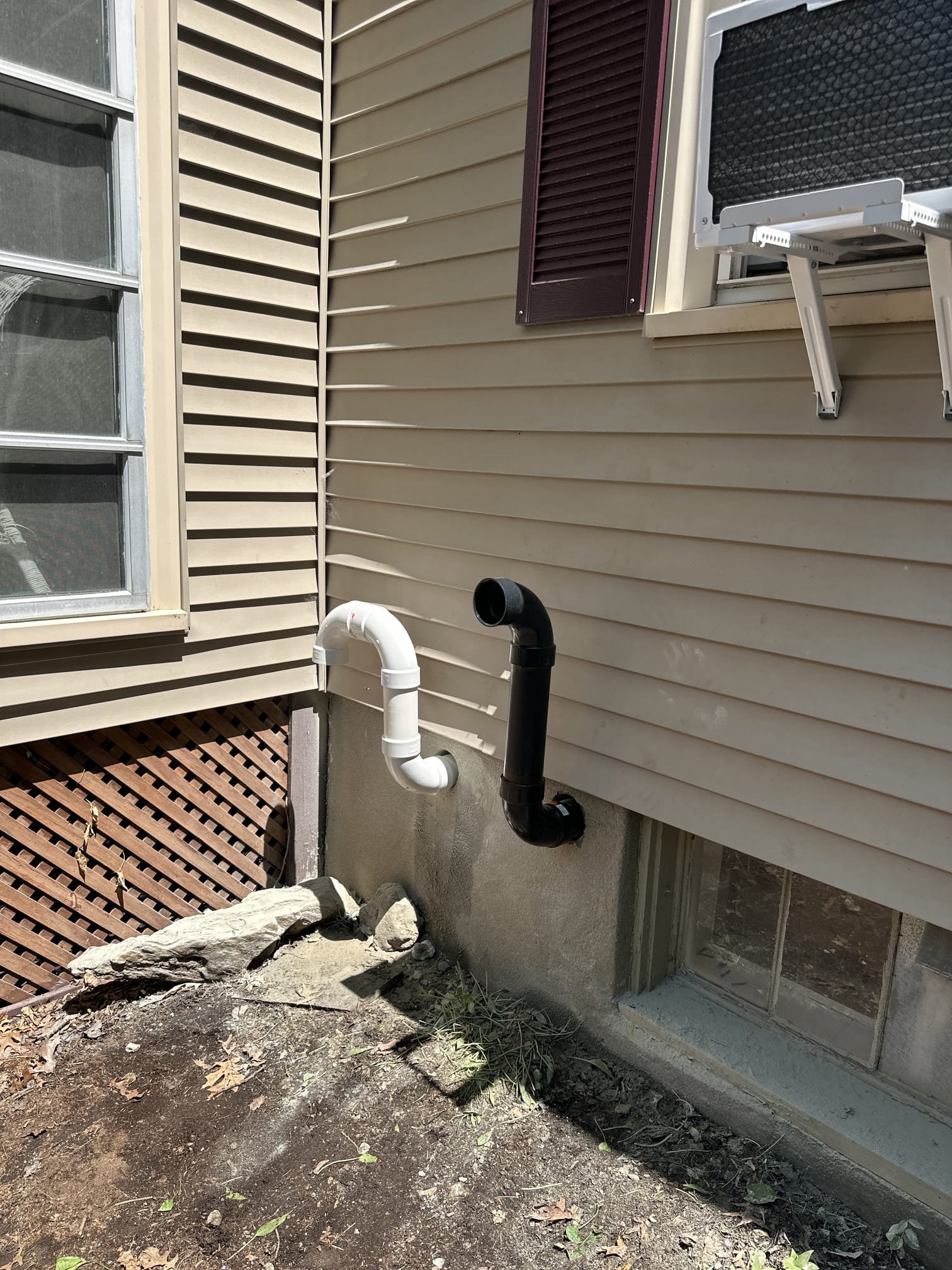Neat external drain and vent work shows the care homeowners expect from Akian Plumbing, Heating, Cooling & Electric, giving reliable performance.