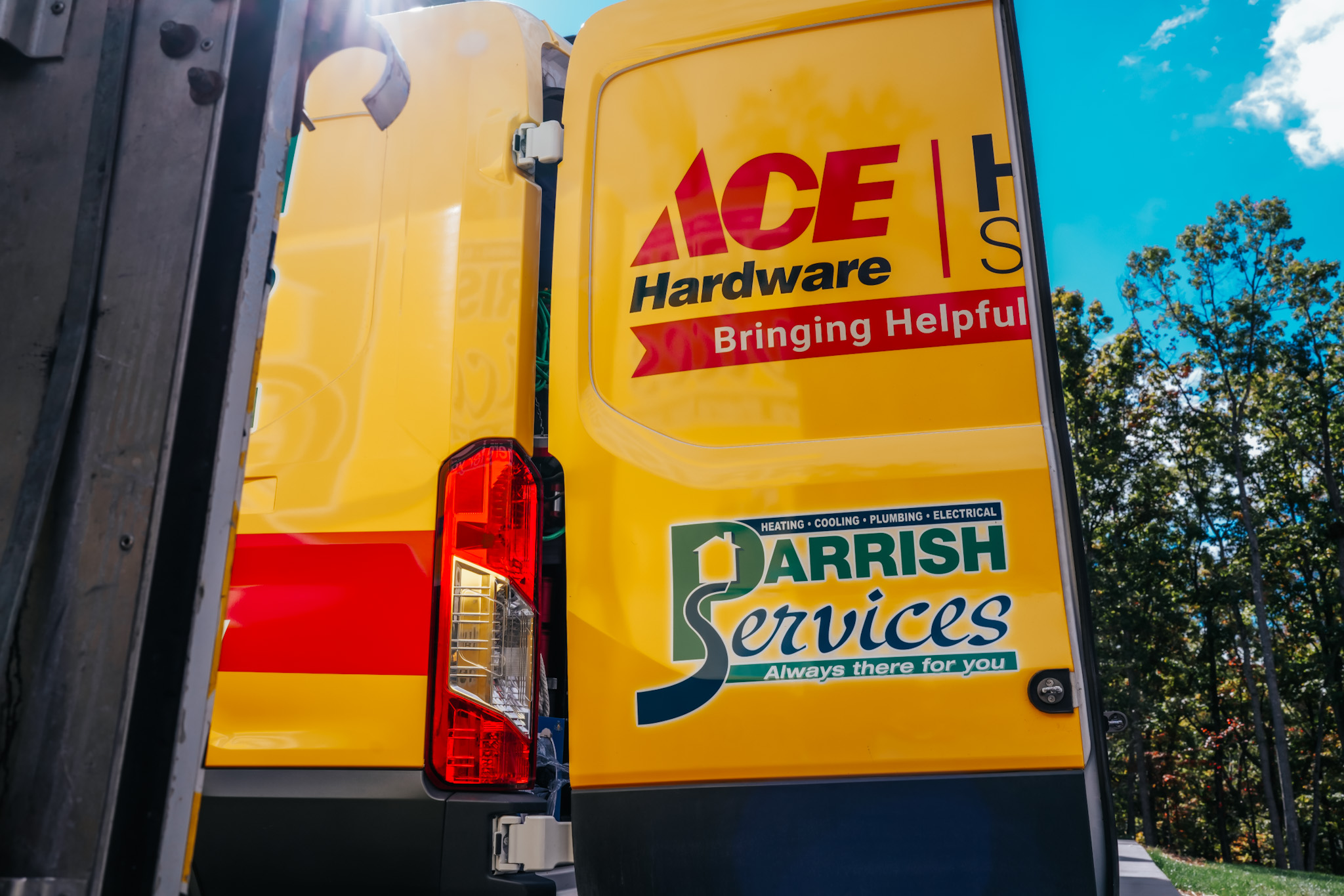 A bright, well-branded Parrish Services van highlights dependable, professional service and visible expertise across HVAC and plumbing.
