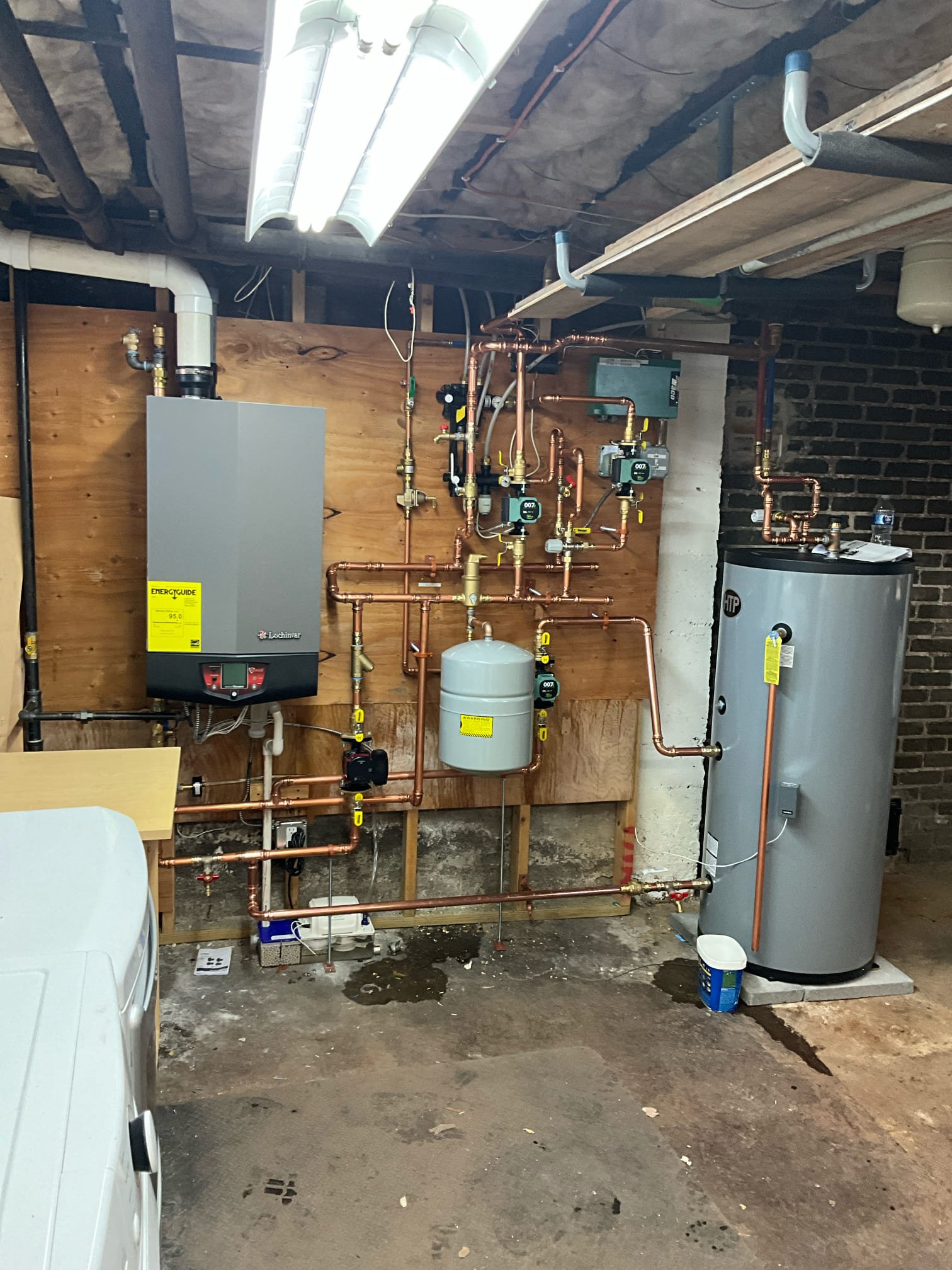 Akian Plumbing, Heating, Cooling & Electric installed a clean, professional heating system layout that emphasizes reliable performance and serviceability.
