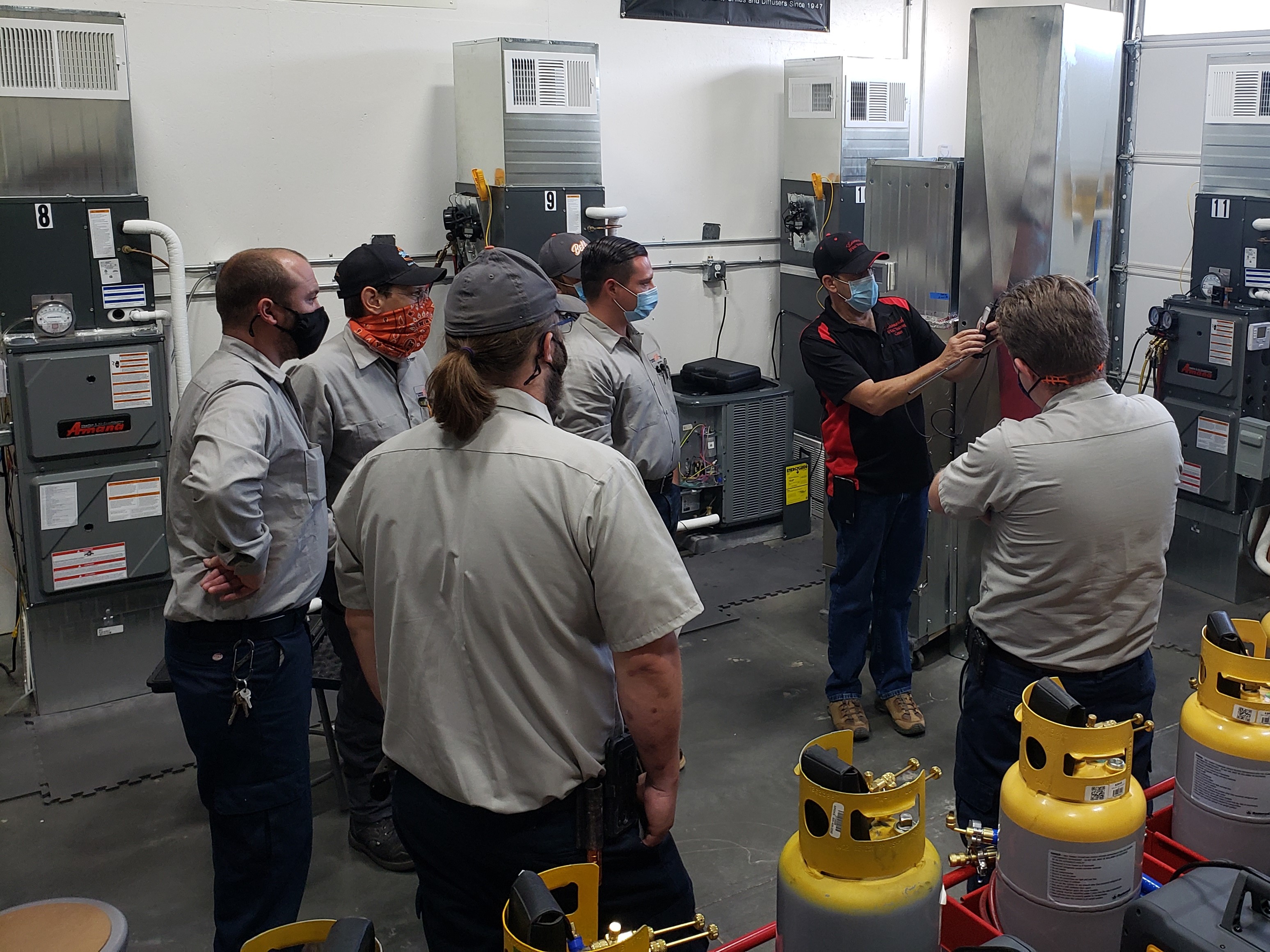 Bell Plumbing, Heating, Cooling & Electrical demonstrates its commitment to expertise and professional service in HVAC training sessions.