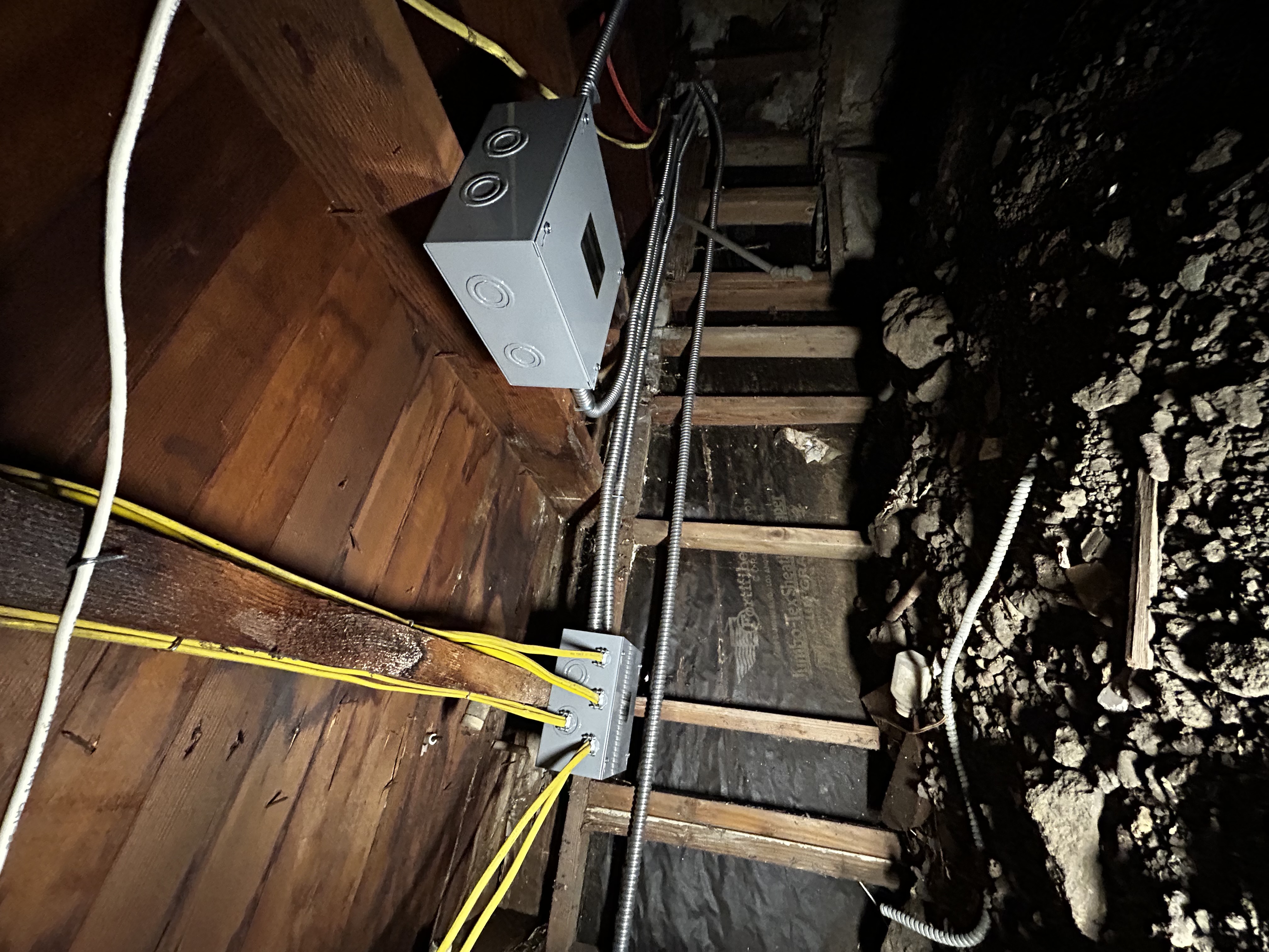 Powell Electric demonstrates careful crawlspace wiring and secure junction box installation to ensure safe, reliable electrical service.