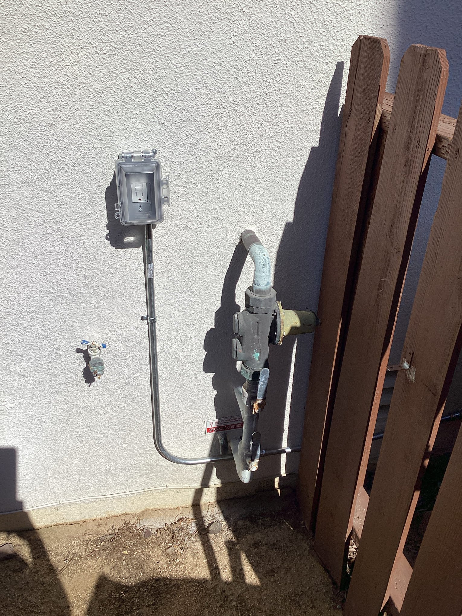 Powell Electric installed a neat weatherproof outdoor outlet with durable conduit, delivering reliable and safe workmanship homeowners can trust.