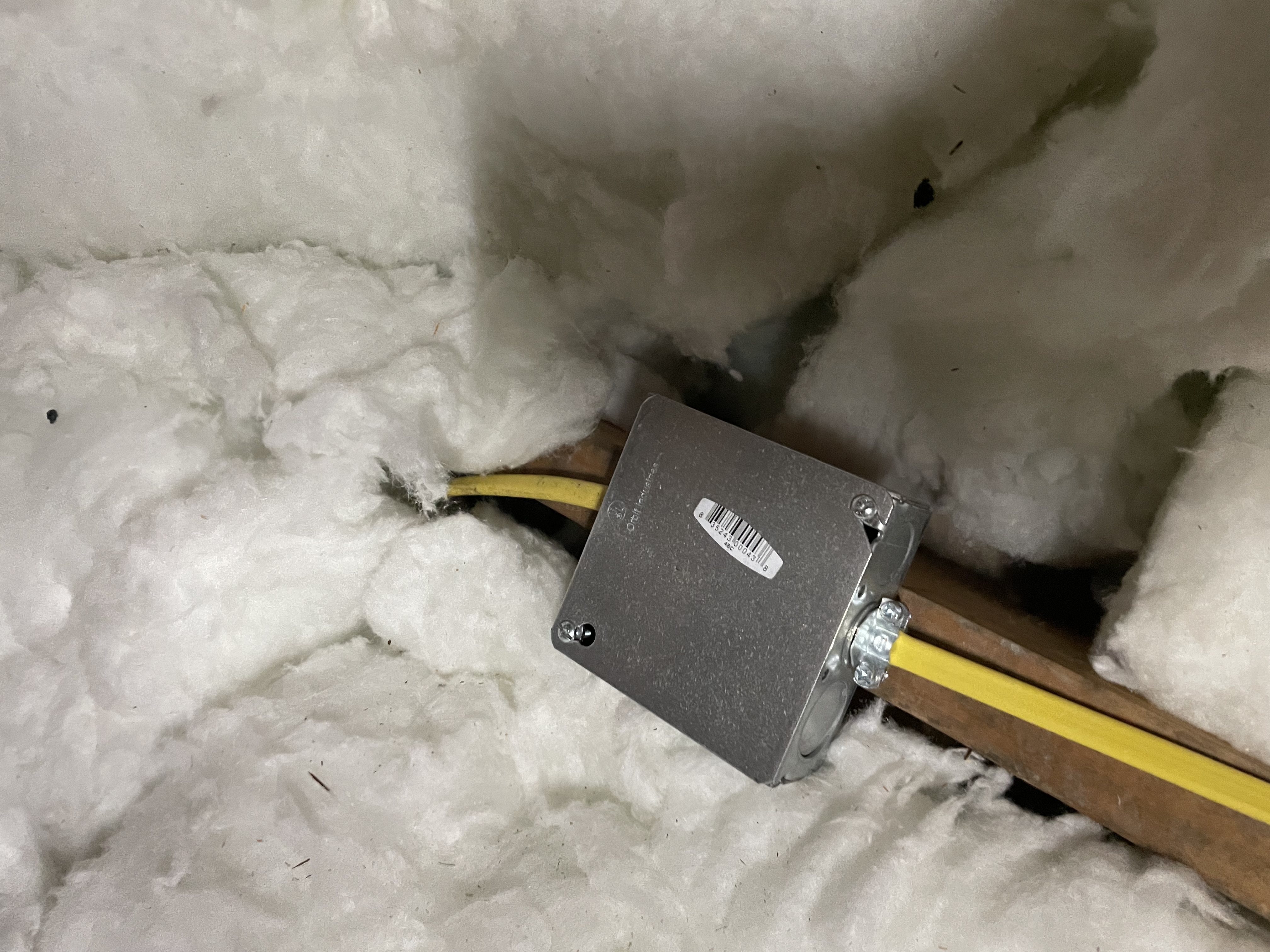 Powell Electric demonstrates careful, code-conscious attic wiring with tidy cable routing and a secure junction box for lasting safety.