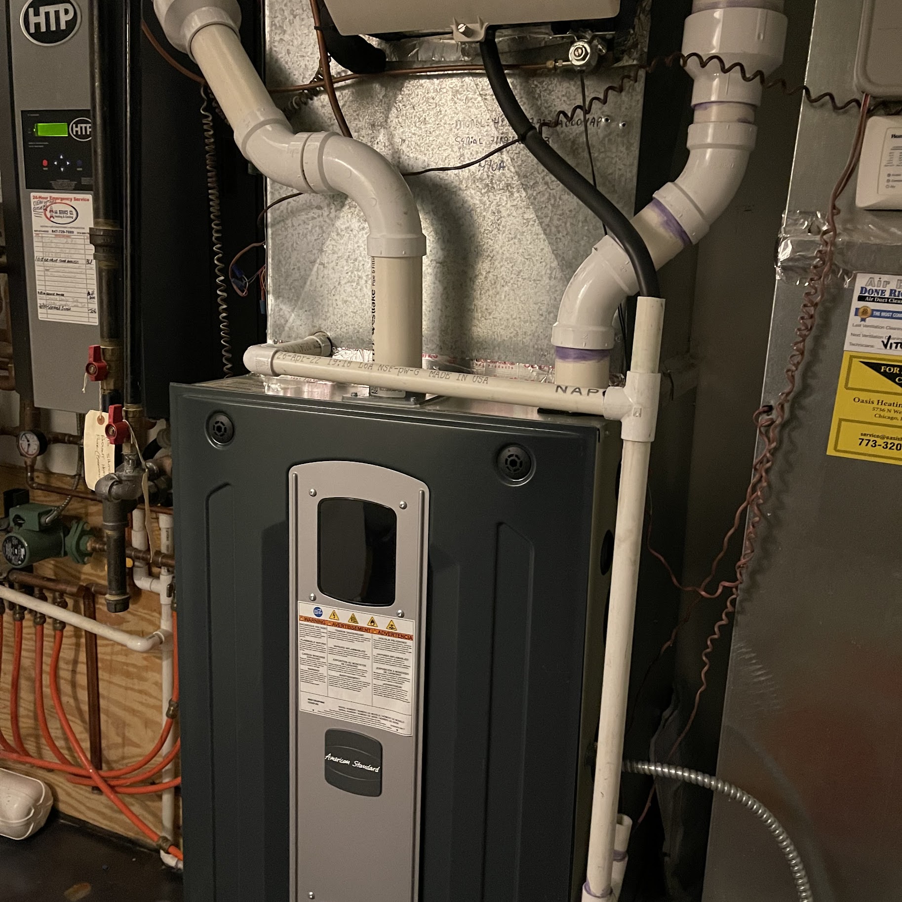 Reliable workmanship and clean installation give homeowners confidence, shown here by Oasis Heating and Cooling’s well-organized furnace and drain plumbing.