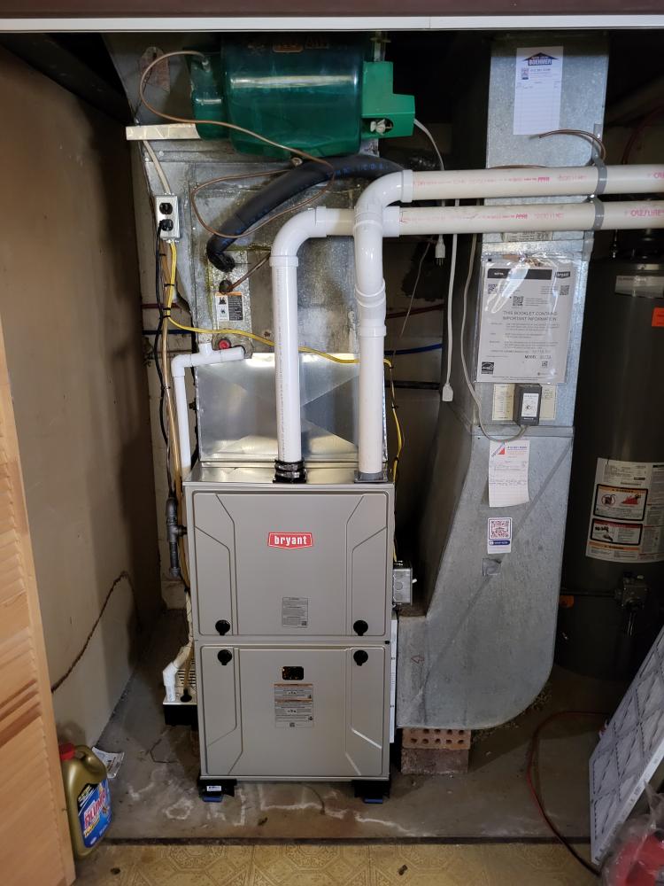 A professionally installed Bryant furnace with tidy venting and documentation shows the care customers expect from Boehmer Heating & Cooling.