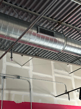 Clean, professionally installed ductwork highlights AccuTemp Heating & Air Conditioning's commitment to reliable HVAC craftsmanship for commercial spaces.