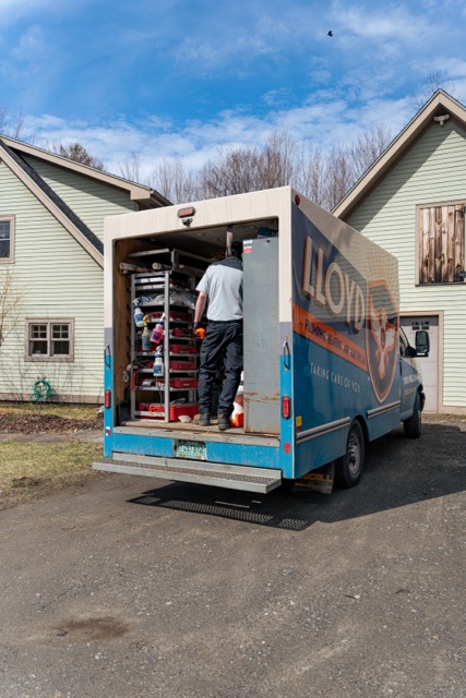 A Lloyd Plumbing, Heating, Air, Electrical technician arrives prepared and organized for reliable residential service, showing commitment to professional workmanship.