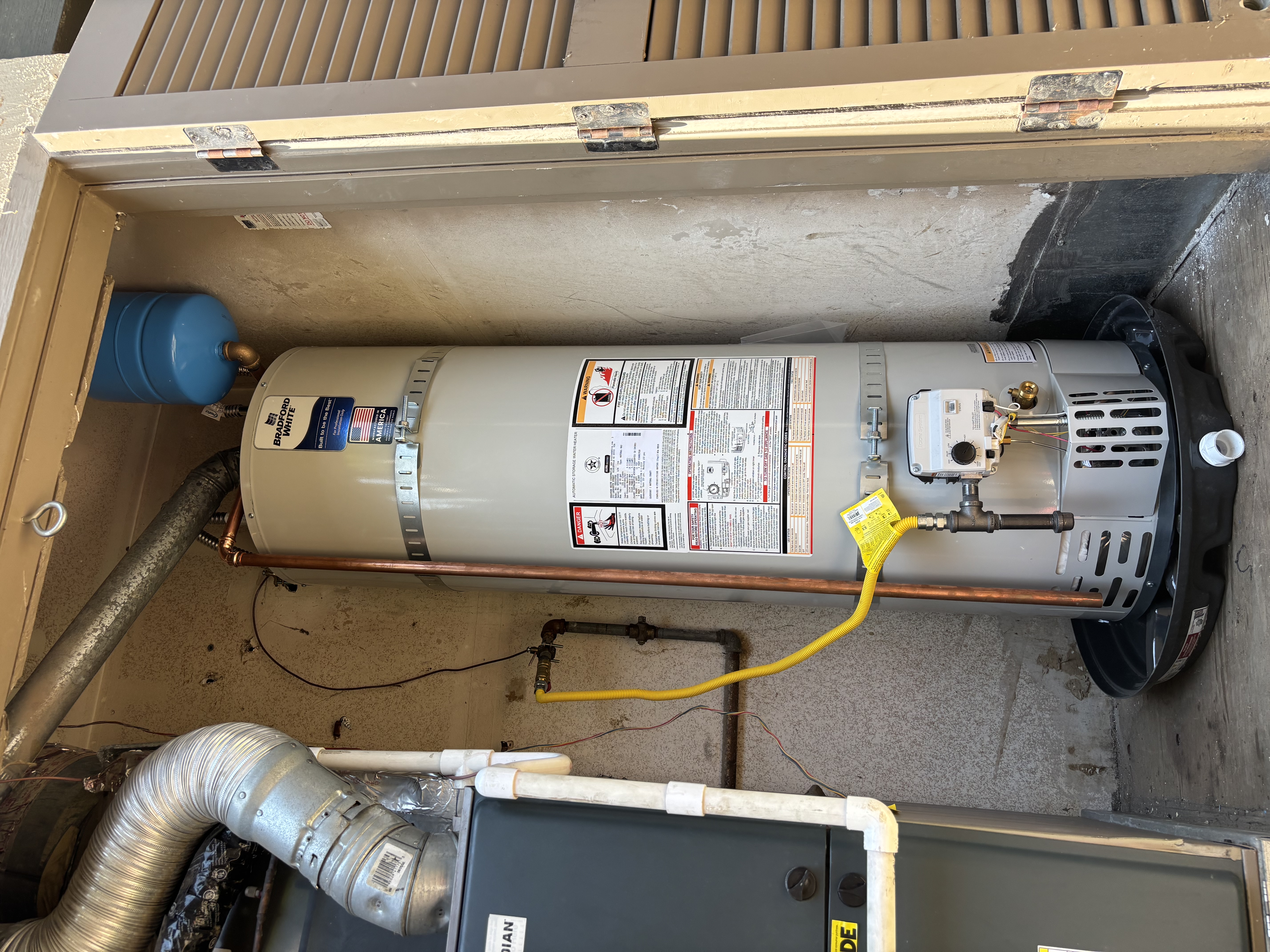 Island Plumbing installed a reliable Bradford White water heater with professional piping and a safety drip pan for lasting peace of mind.