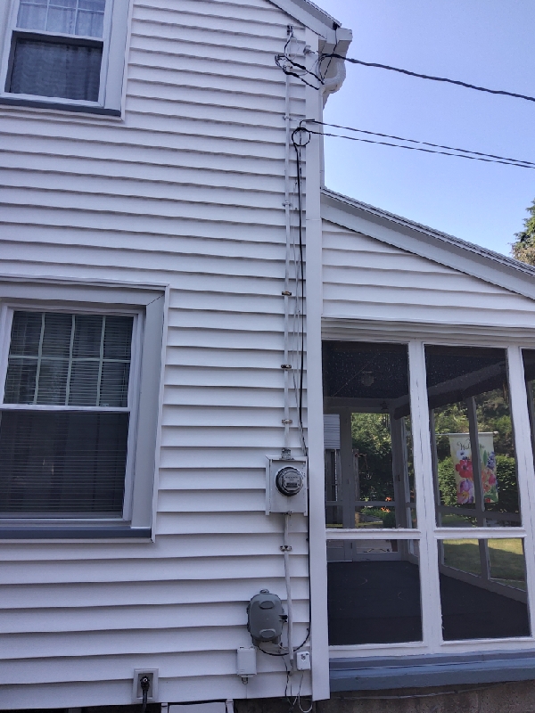 Dependable residential electrical work from Doctor Electric, showing neat service routing and a professionally installed meter for homeowner peace of mind.