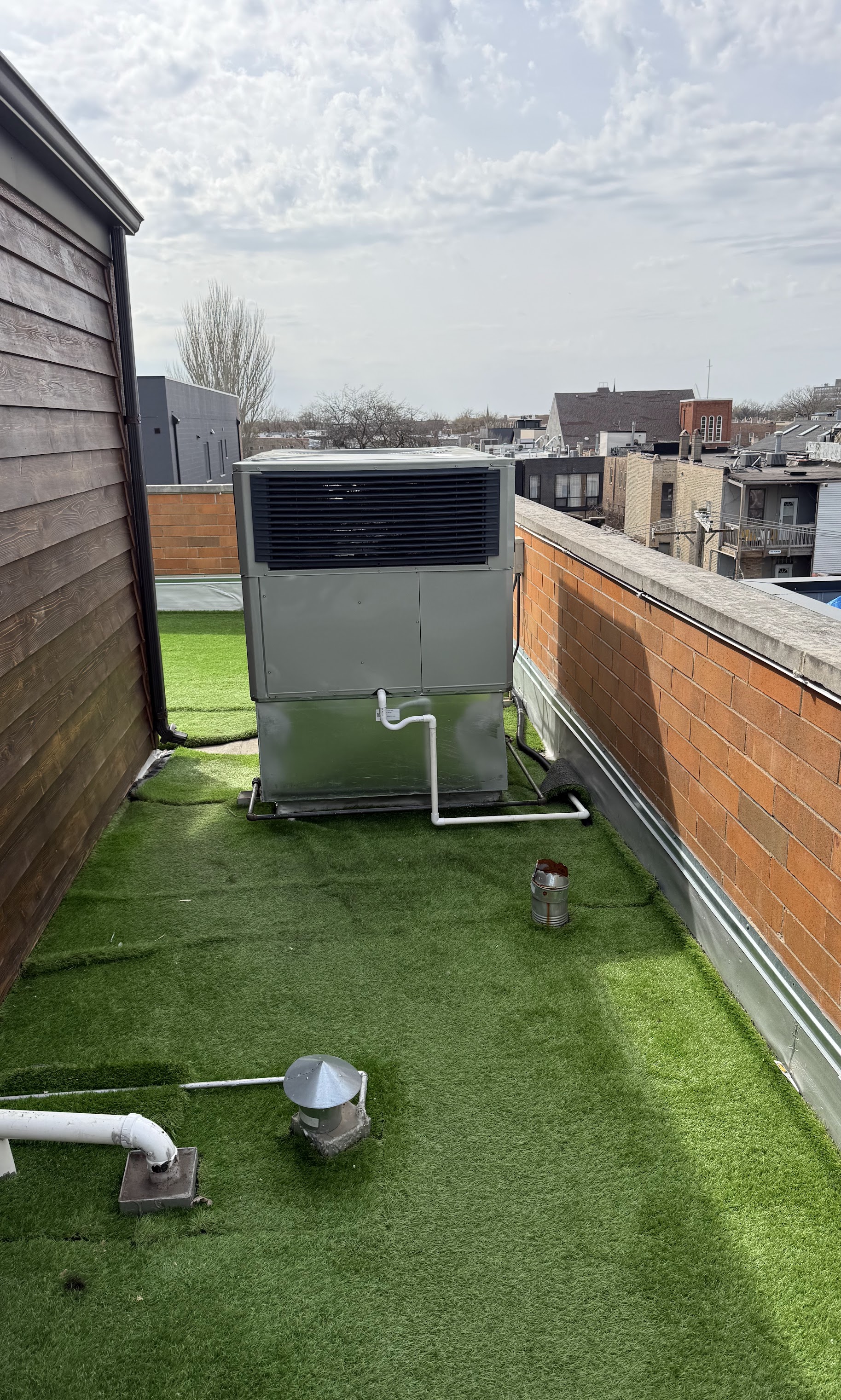 Reliable rooftop HVAC performance showcased with tidy installation and drainage, bringing dependable comfort from Oasis Heating and Cooling.