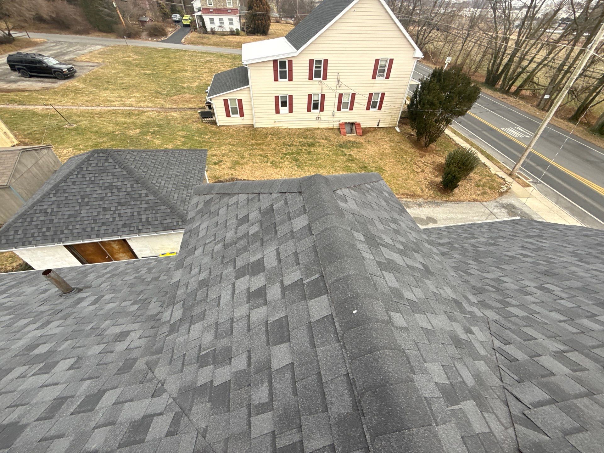 Showcasing precise shingle alignment and durable ridge work, Mosaic Roofing & Exteriors delivers reliable residential roof craftsmanship customers can trust.