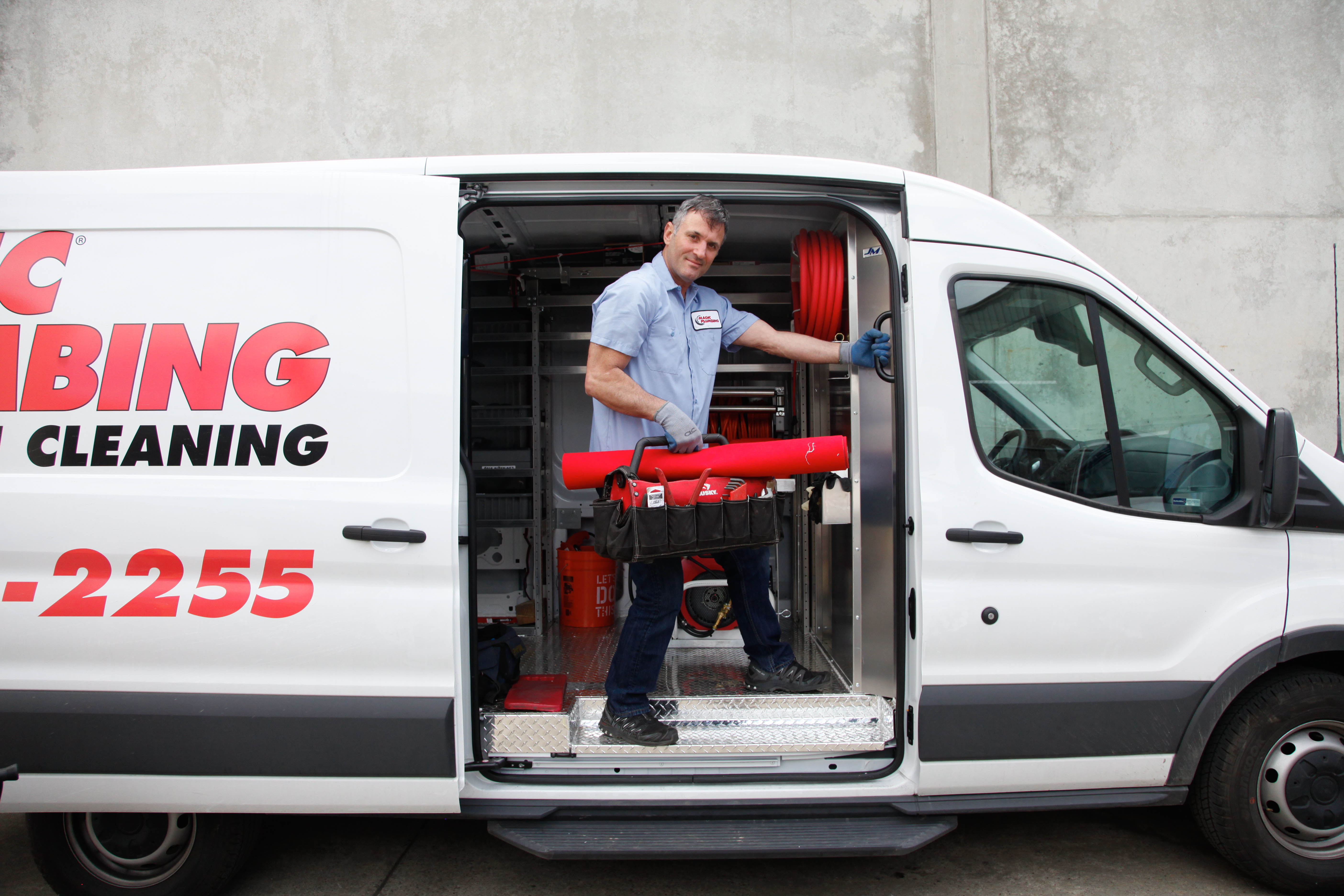 Confident and ready for the job, Magic Plumbing Heating & Cooling arrives with a skilled technician and organized equipment for reliable service.