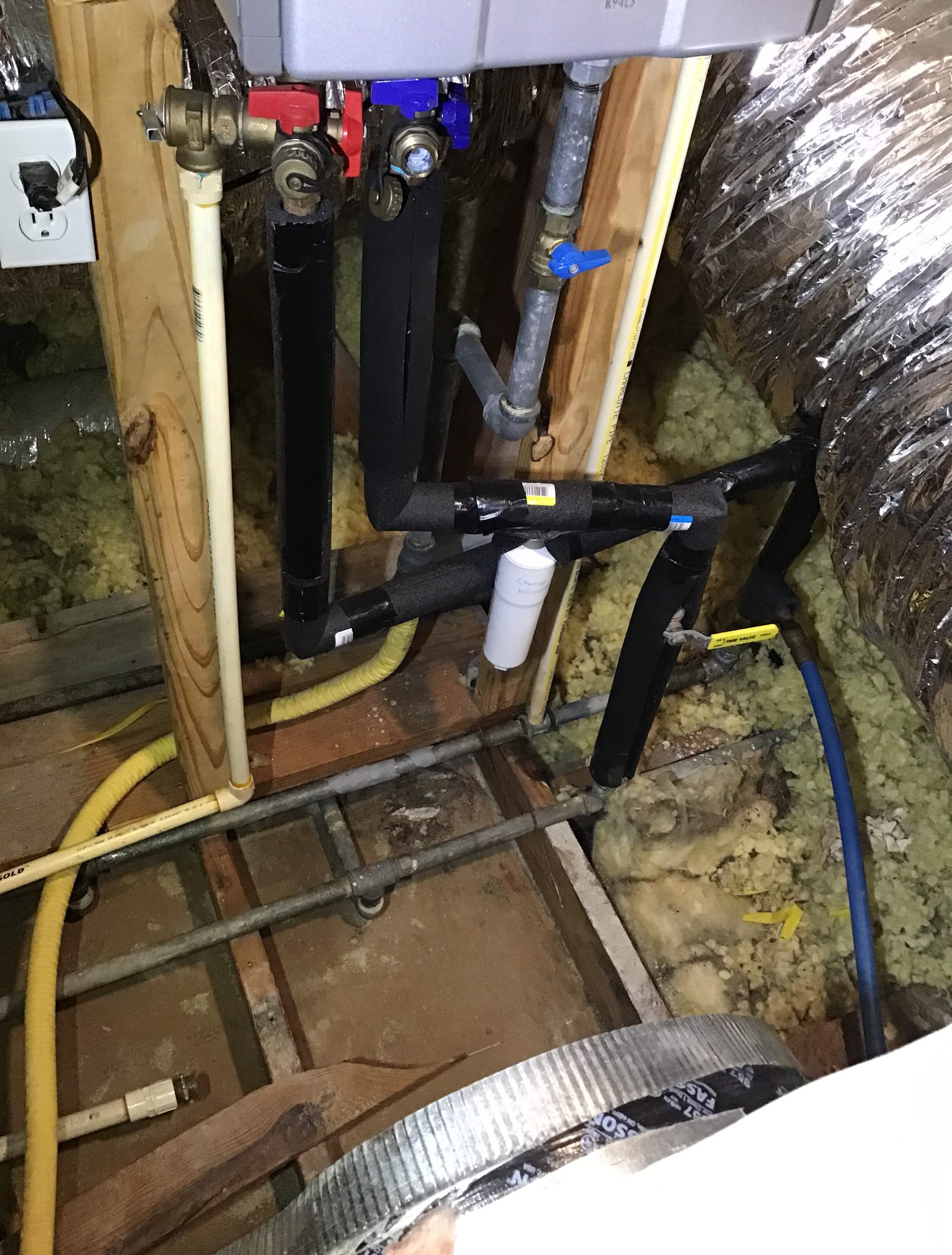 Clean, insulated line work and clearly labeled valves demonstrate Abacus Plumbing, Air Conditioning & Electrical's dependable craftsmanship and care.