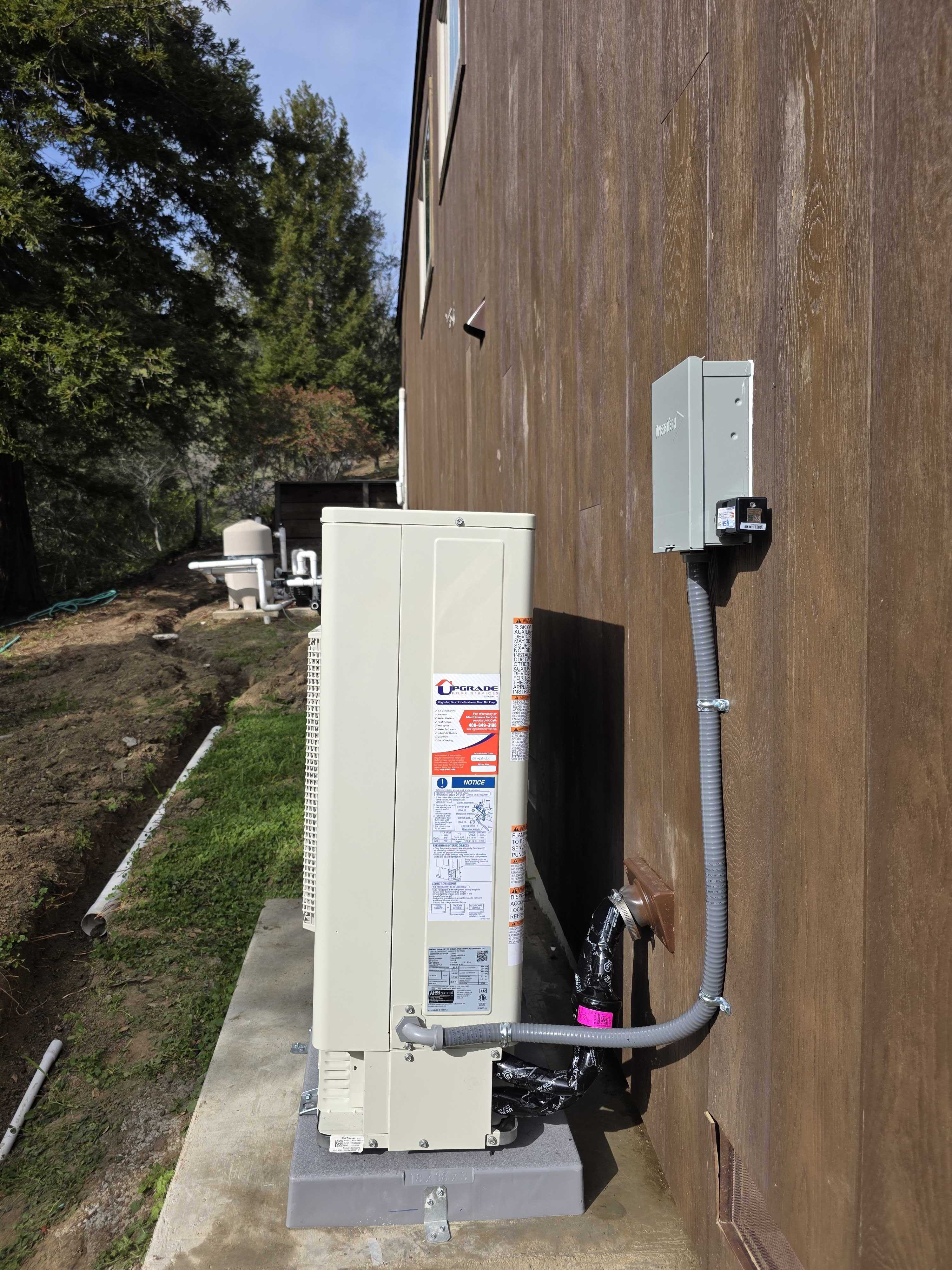 Upgrade Home Services installed this outdoor HVAC unit with careful placement and tidy wiring to ensure reliable, professional performance.