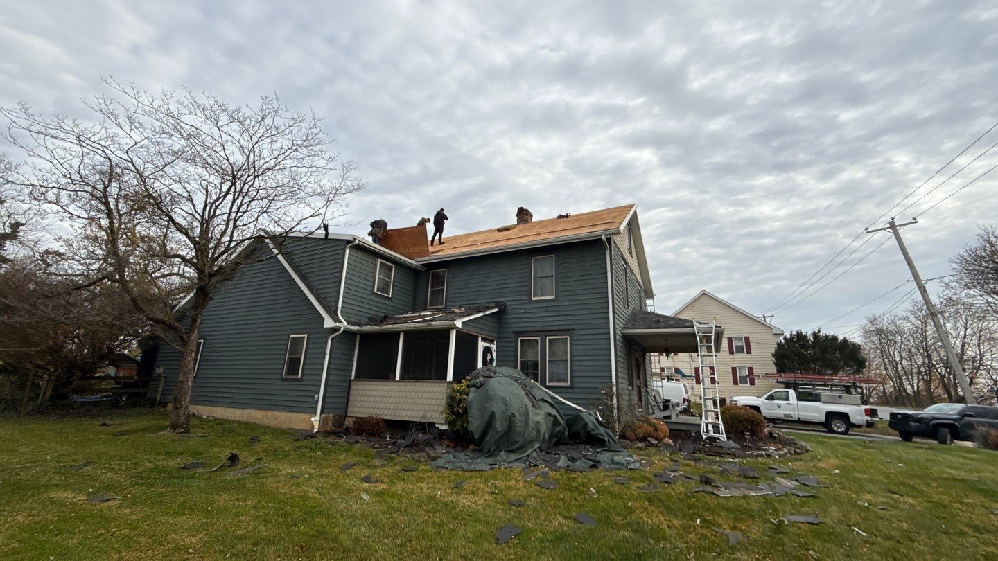 Mosaic Roofing & Exteriors shows skilled roofing teams on-site restoring a home with careful staging and dependable workmanship.