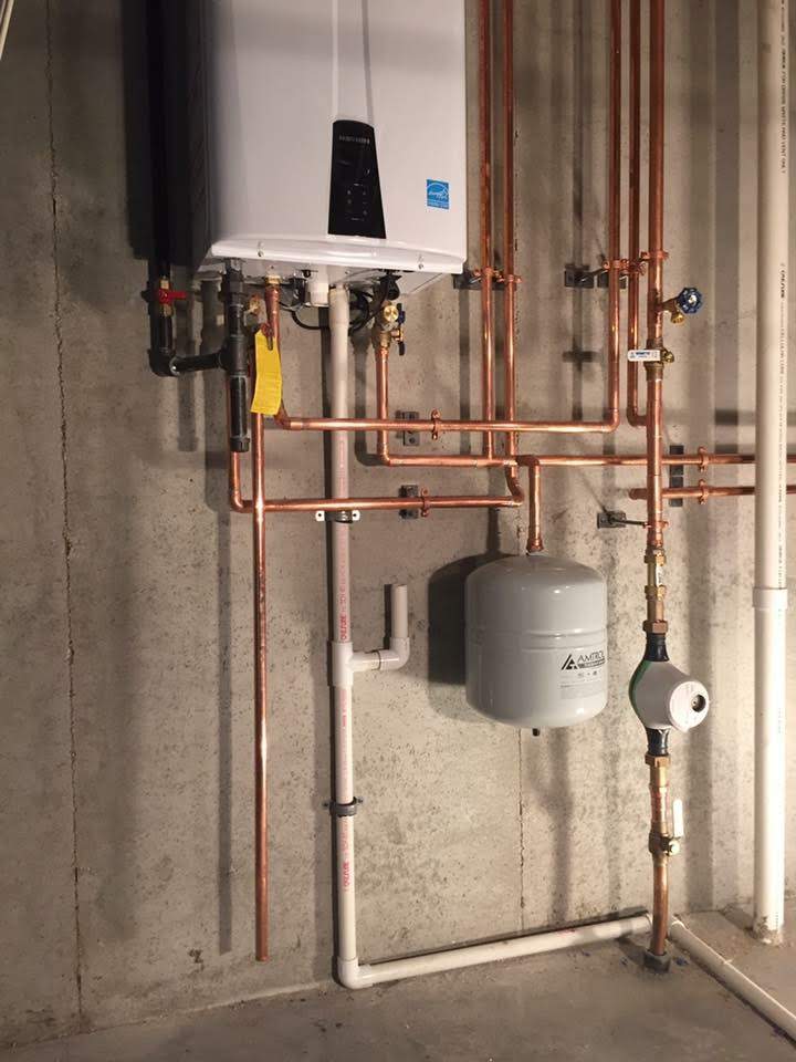 A clean, professional installation by Magic Plumbing Heating & Cooling showcases precise piping and reliable components for lasting performance.