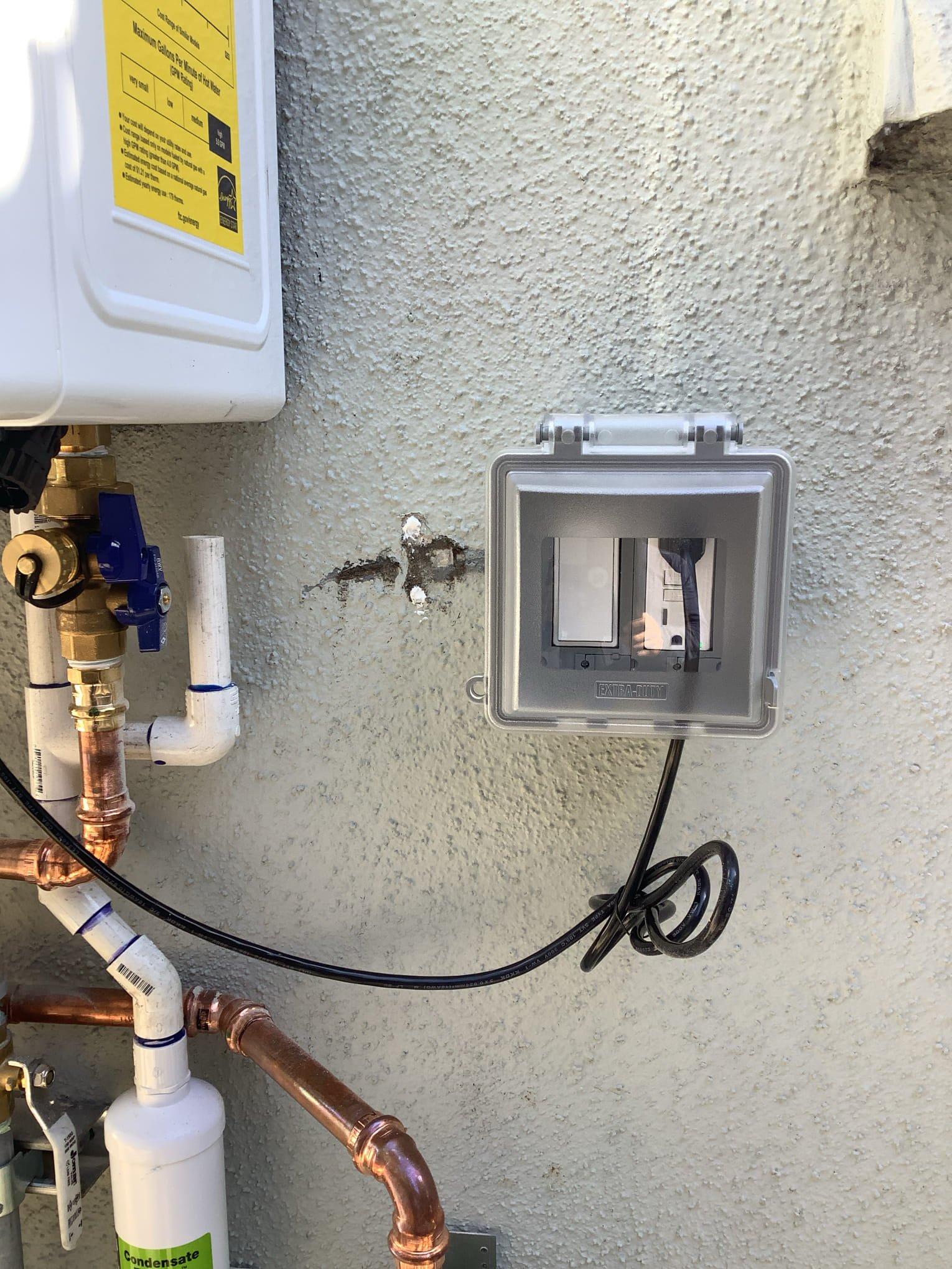 Powell Electric installed a durable weatherproof outlet with tidy piping nearby to ensure safe, long-lasting outdoor performance.