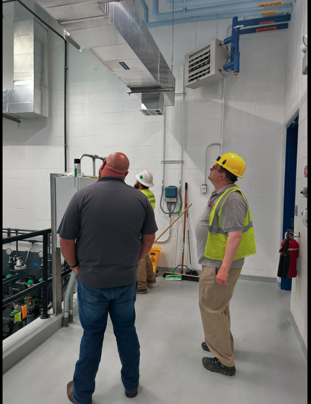 Hope Plumbing demonstrates professional workmanship and site cleanliness while inspecting ductwork to ensure reliable system performance.