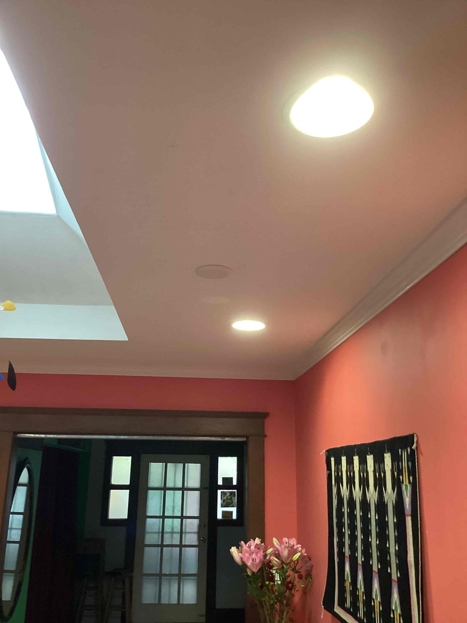 Bright, neatly installed recessed lighting creates a welcoming home entryway, showcasing Powell Electric’s reliable craftsmanship and attention to detail.