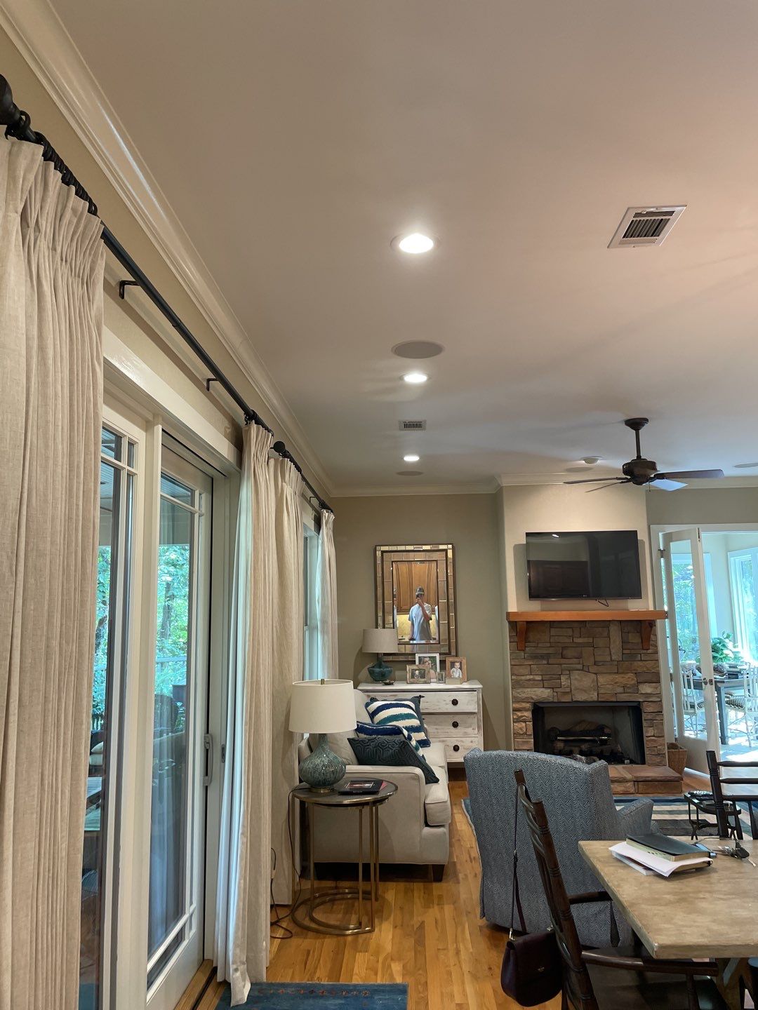 Bright, carefully installed recessed lighting and AV work create a welcoming living space, showcasing C&T Electric LLC’s craftsmanship.