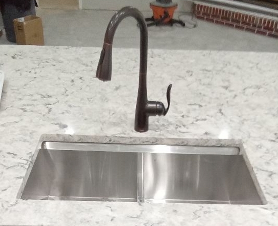 Elevate your kitchen with Alternate Design Plumbing, Inc.'s expert sink installations, showcasing quality and modern design.
