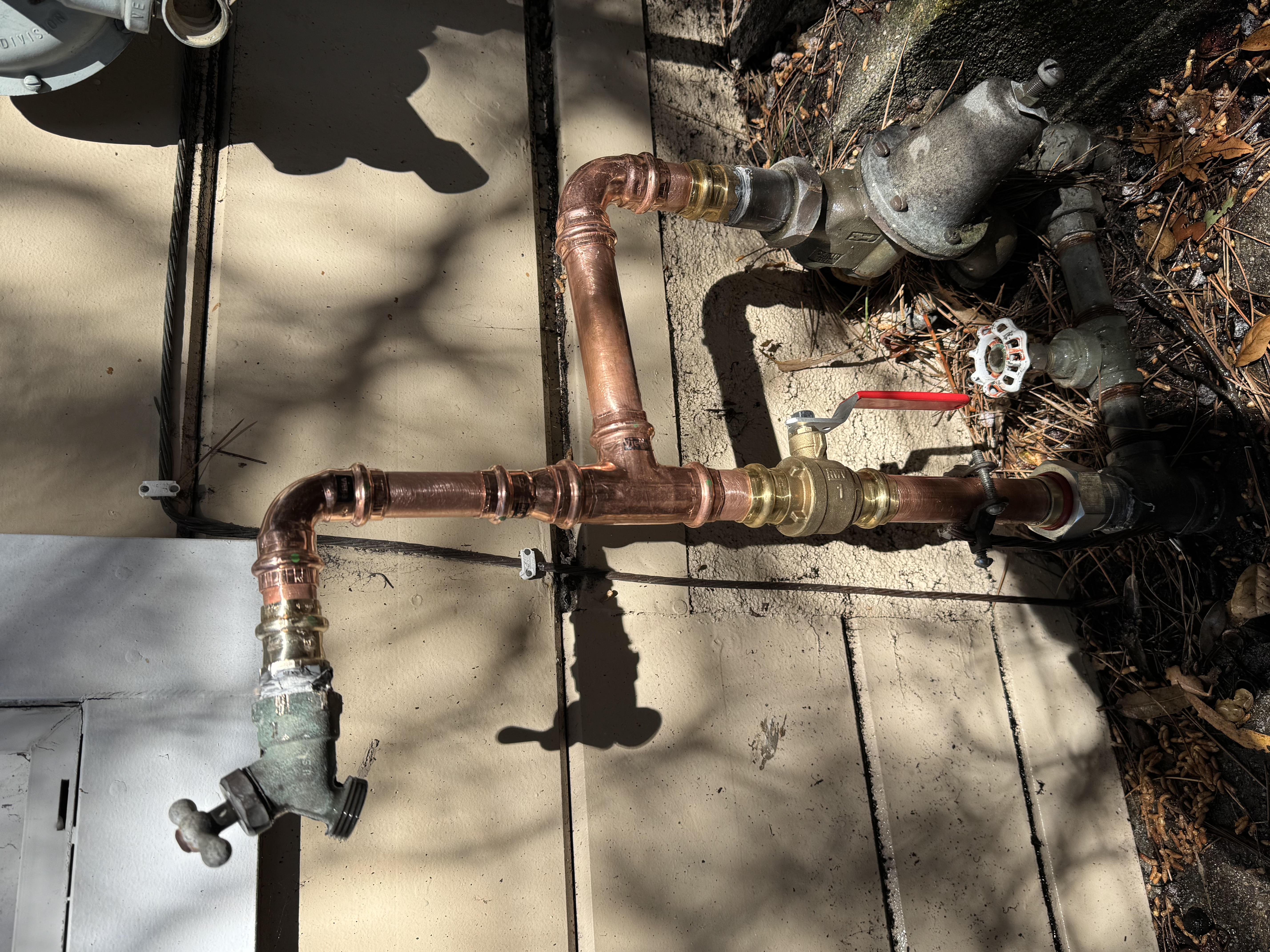 Freshly installed copper fittings and a clear shutoff show Big Island Plumbing’s reliable craftsmanship and lasting value for homeowners.
