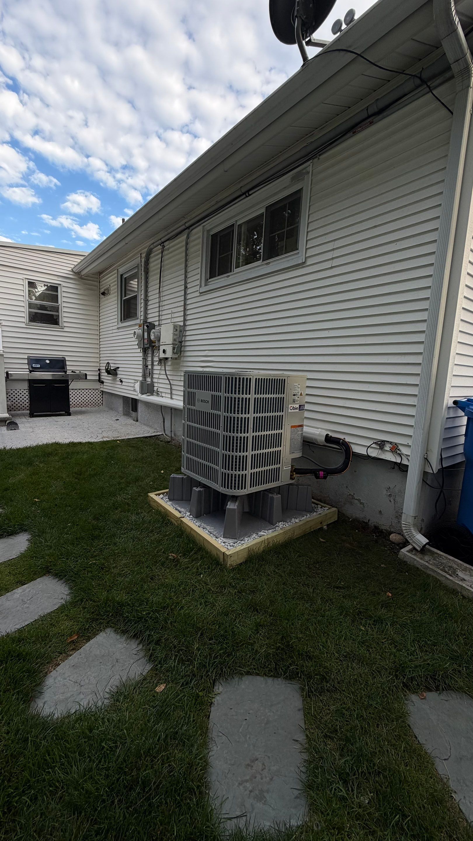 Clean, elevated AC installation highlights Obie Comfort Solutions' craftsmanship and care, ensuring reliable performance and long-term value.