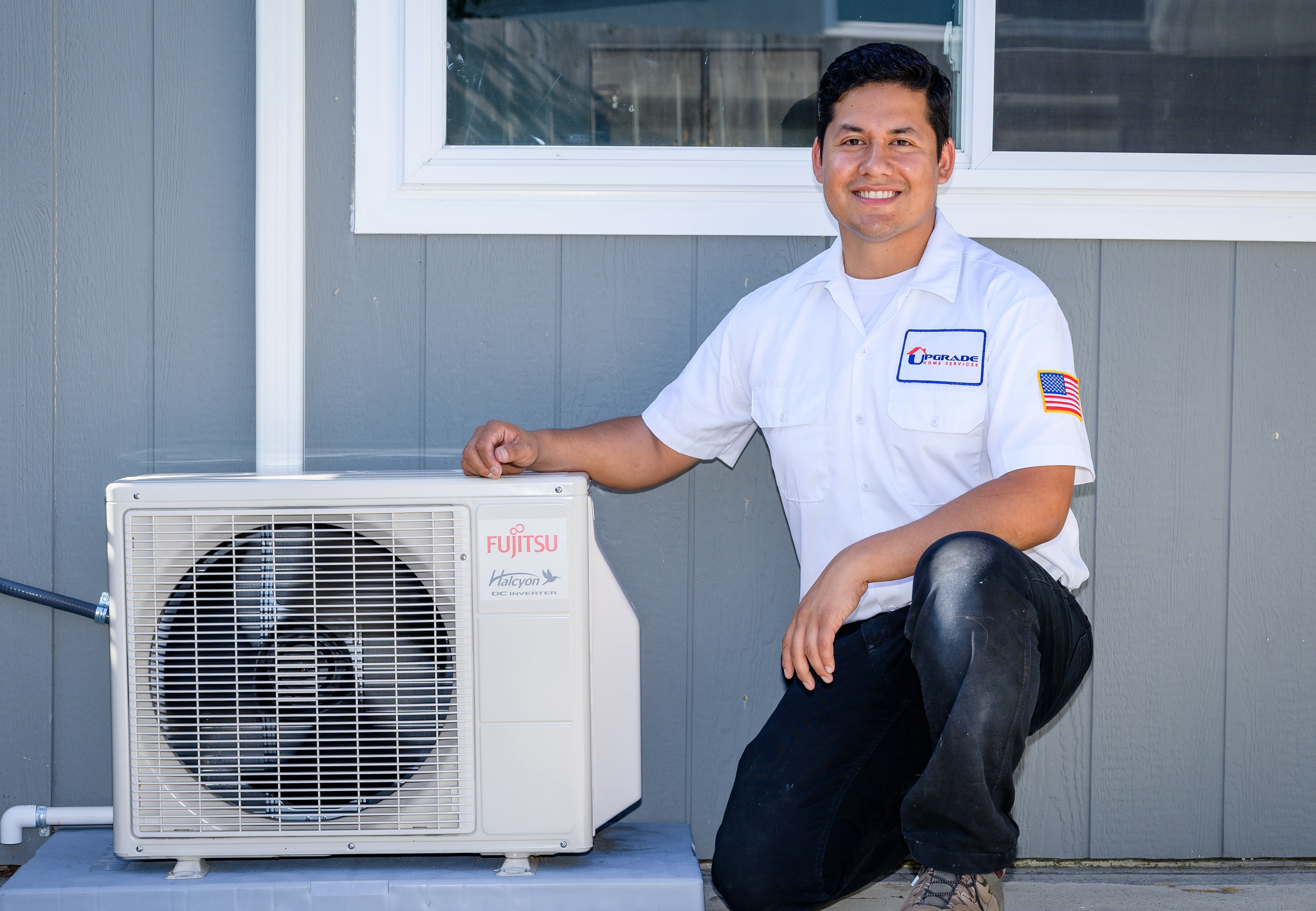 A friendly, professional technician from Upgrade Home Services showcases careful installation and trustworthy workmanship for reliable home comfort.