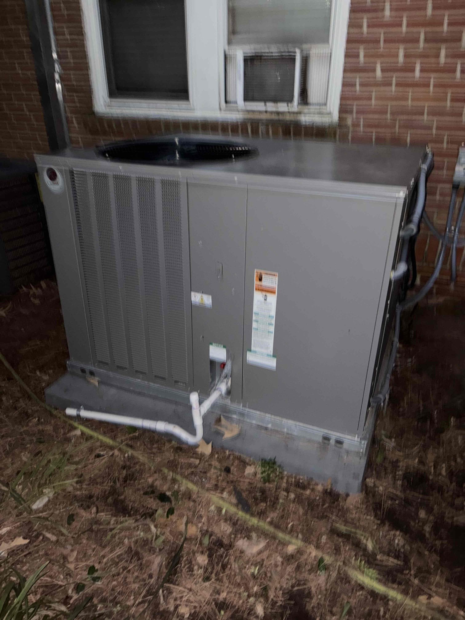 Dependable installation and tidy drainage show the care Dawson's Electric & Air brings to every HVAC replacement job for lasting comfort.