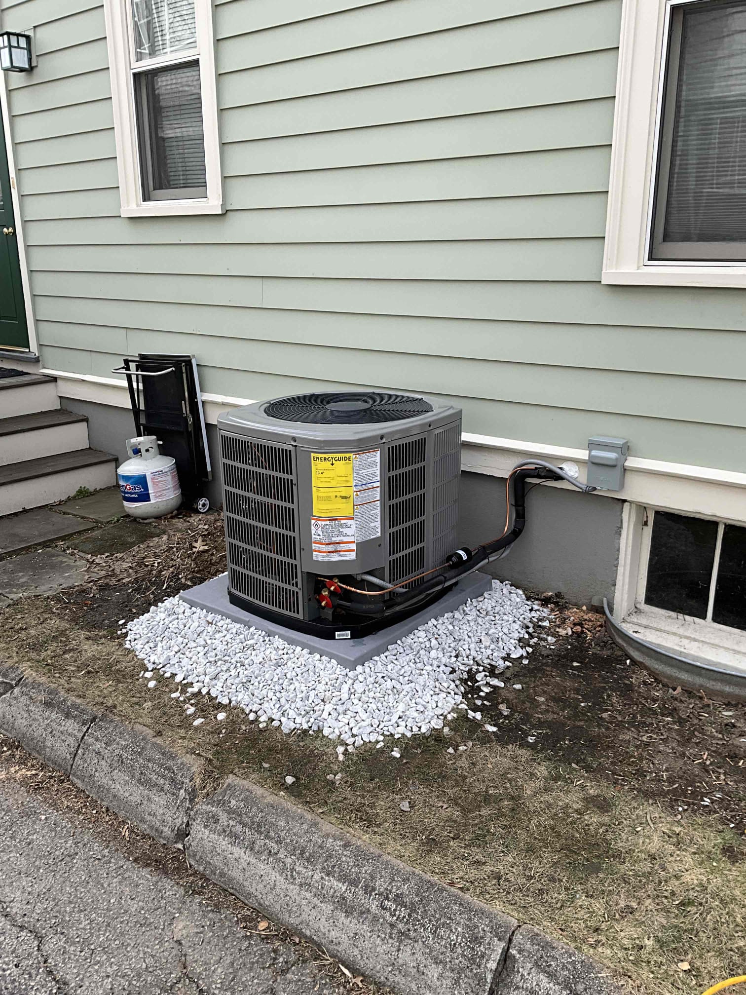 A clean, code-conscious installation by Akian Plumbing, Heating, Cooling & Electric shows reliable HVAC placement and neat workmanship for lasting performance.