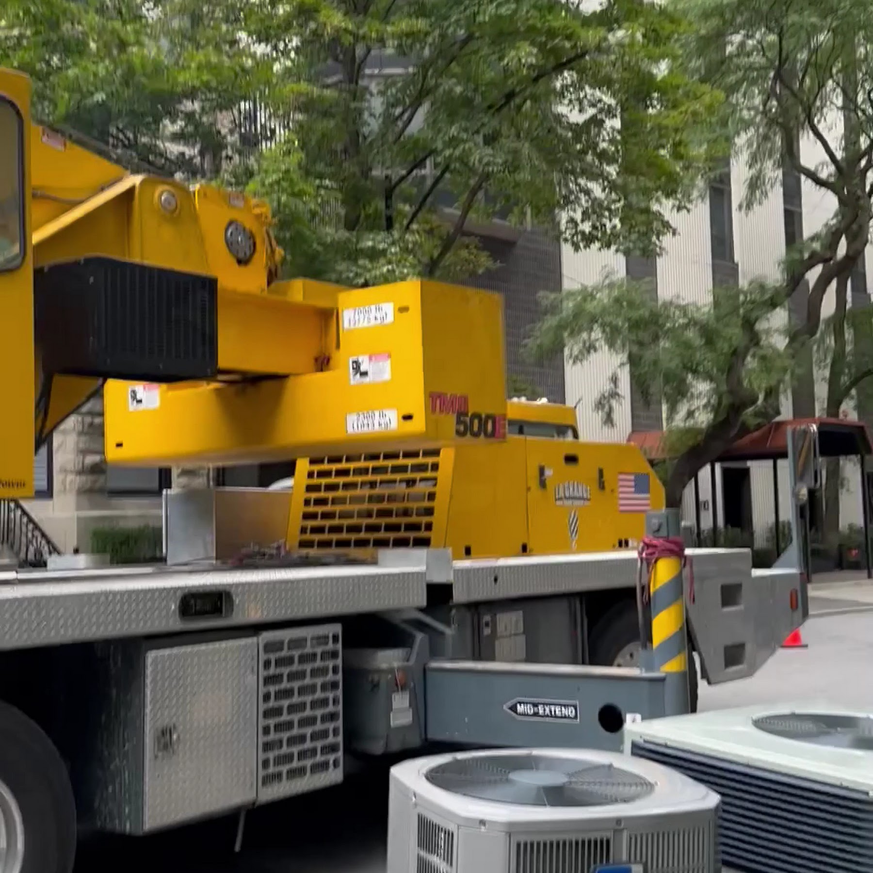Oasis Heating and Cooling demonstrates reliable, professional on-site HVAC service with heavy-duty equipment for safe, efficient installations.