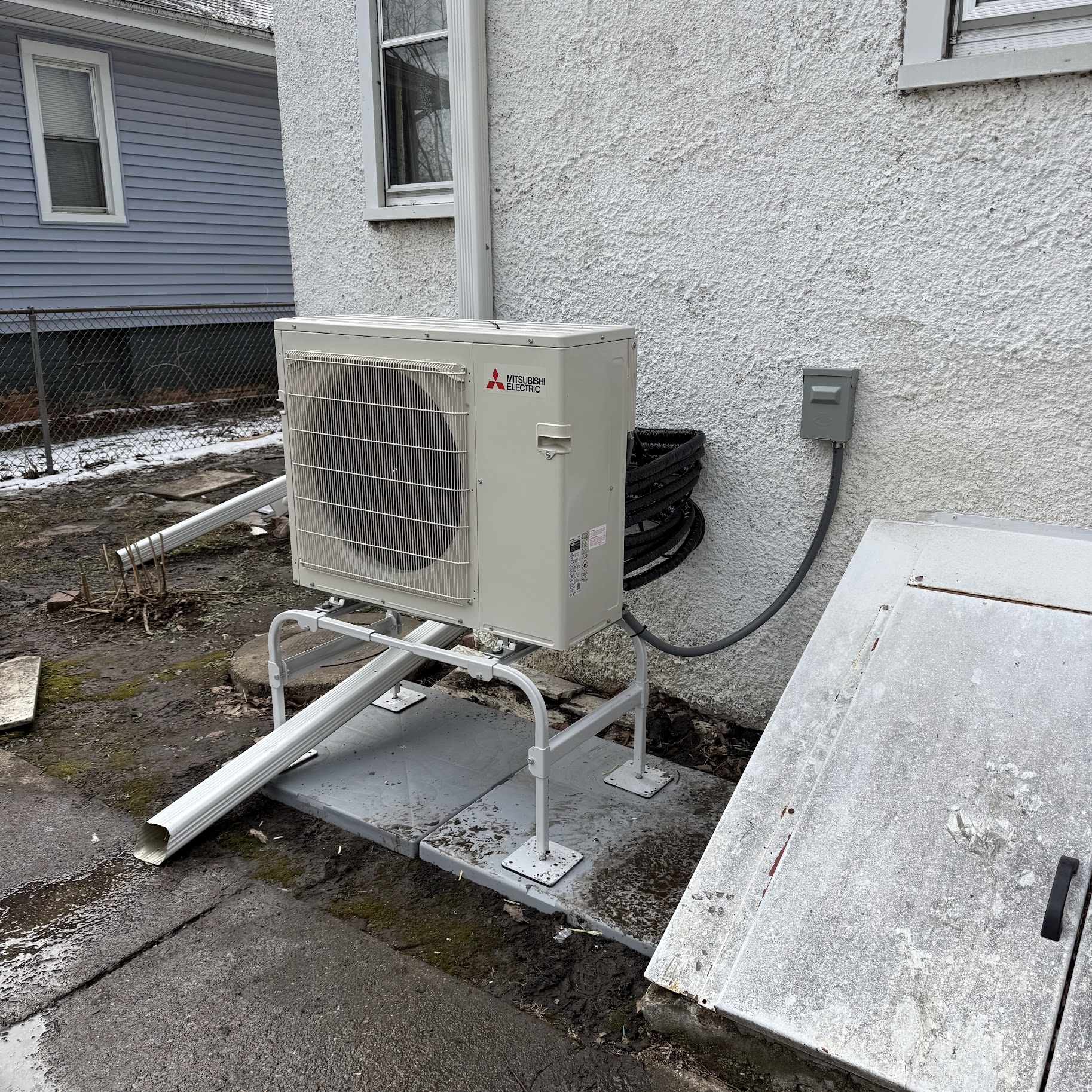 Solid residential installation shows Oasis Heating and Cooling delivering reliable outdoor comfort with careful mounting and neat line routing.