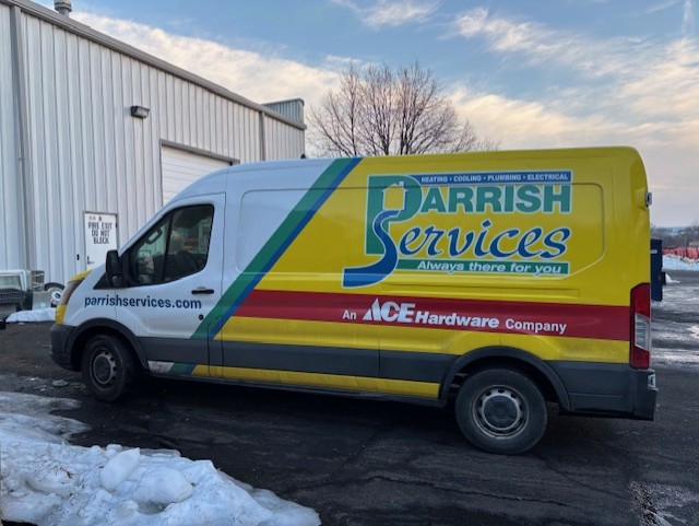 A Parrish Services van parked and ready to serve, showcasing reliable on-site professionalism and fast response for homeowners.