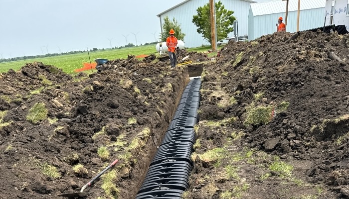 Lanz Plumbing, Heating & Cooling, Inc. showcasing professional trenching and pipe installation services.