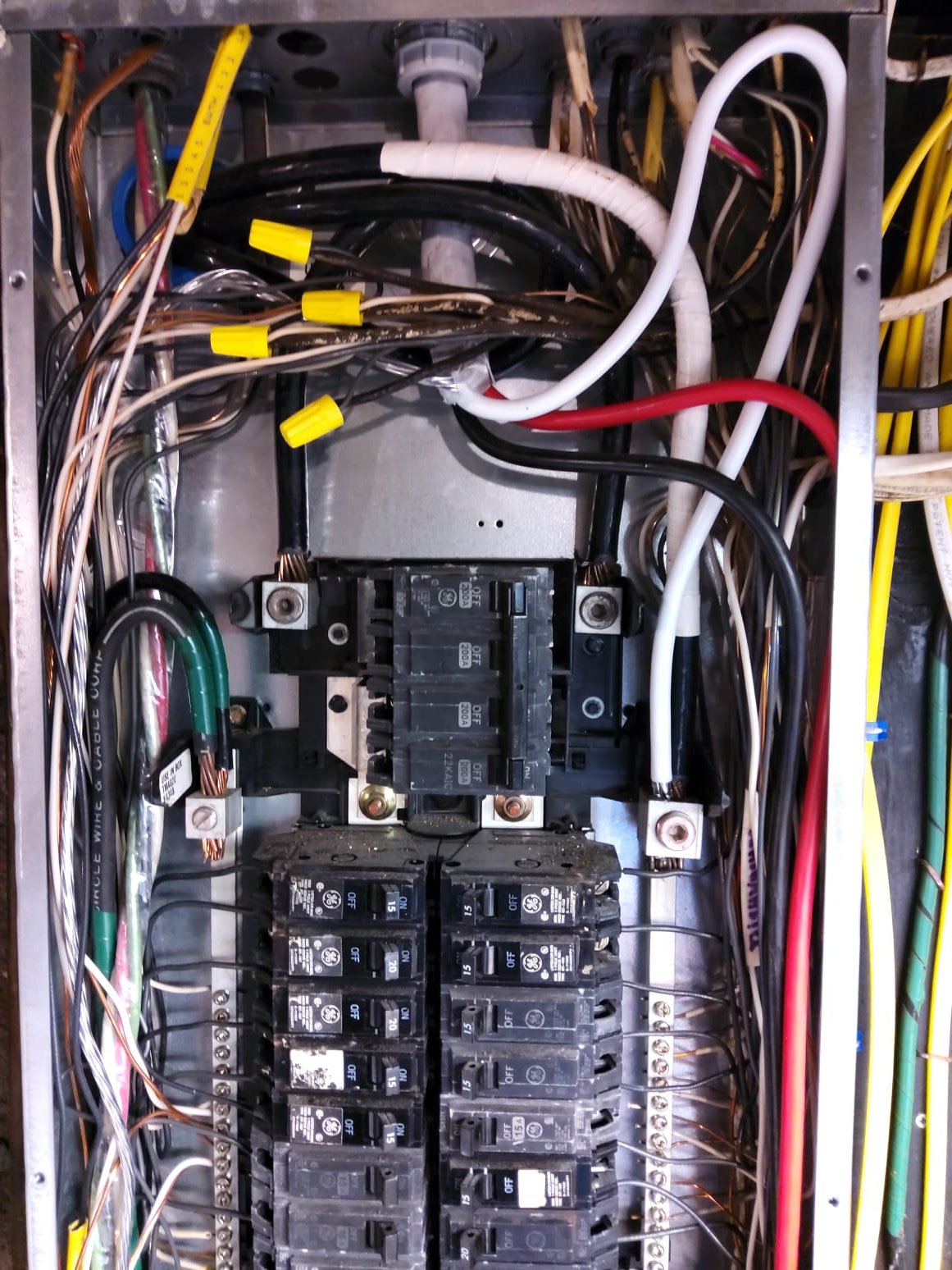 Service Professionals ensures top-tier electrical solutions with precisely organized and expertly installed panels, displaying a commitment to quality and safety.